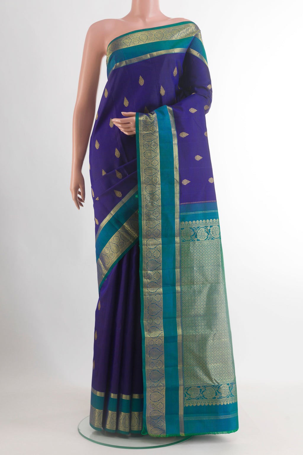 Dark Blue Kanchipuram Silk Saree with Zari Butta on the body and Zari Border.  displayed on a mannequin