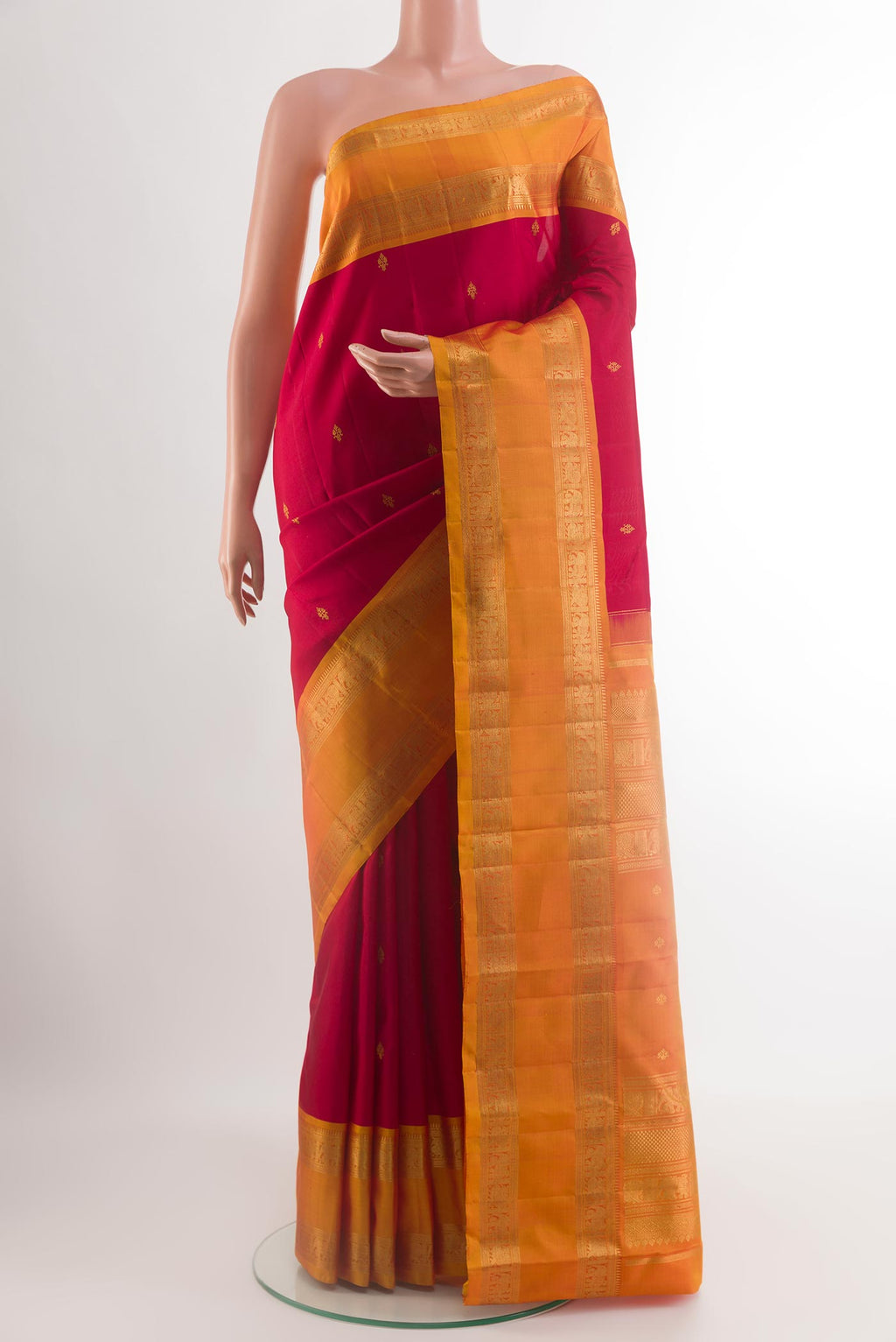 Red Kanchipuram Silk Saree with Zari Butta on the body and Zari Border.  displayed on a mannequin