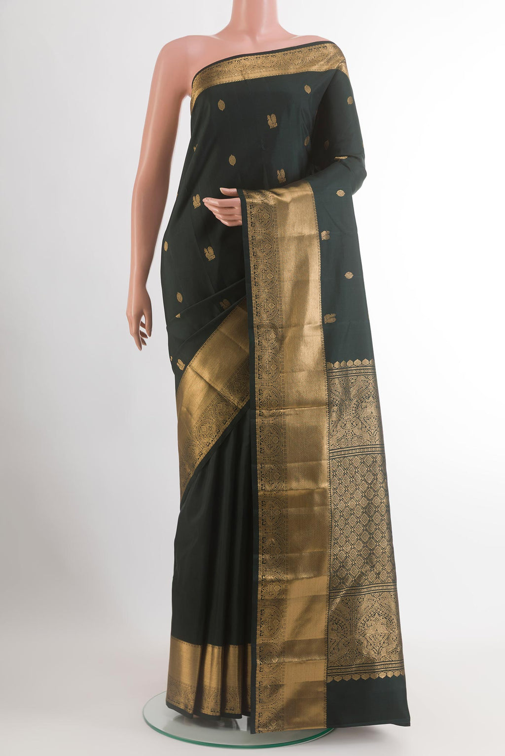 Black Kanchipuram Silk Saree with Zari Butta on the body and Zari Border.  displayed on a mannequin
