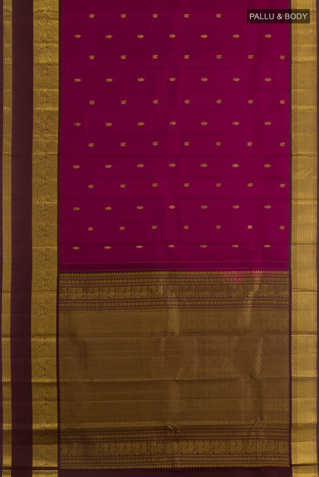 Flat view of Magenta Kanchipuram Silk Saree with Zari Butta on the body and Zari Border. 