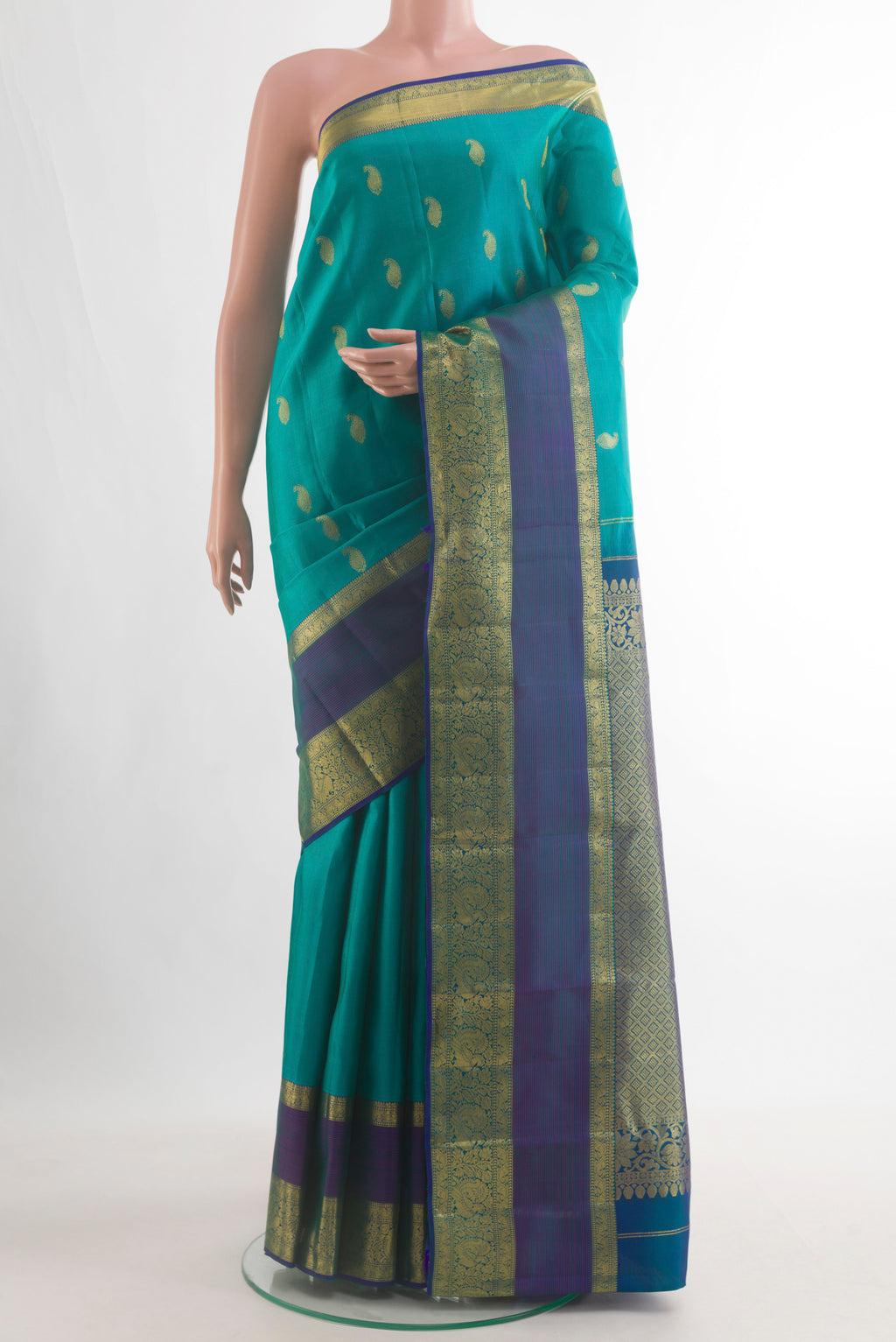 Pure Silk Sea Green Kanchipuram Saree with Zari Butta on the body and Zari Border.  displayed on a mannequin