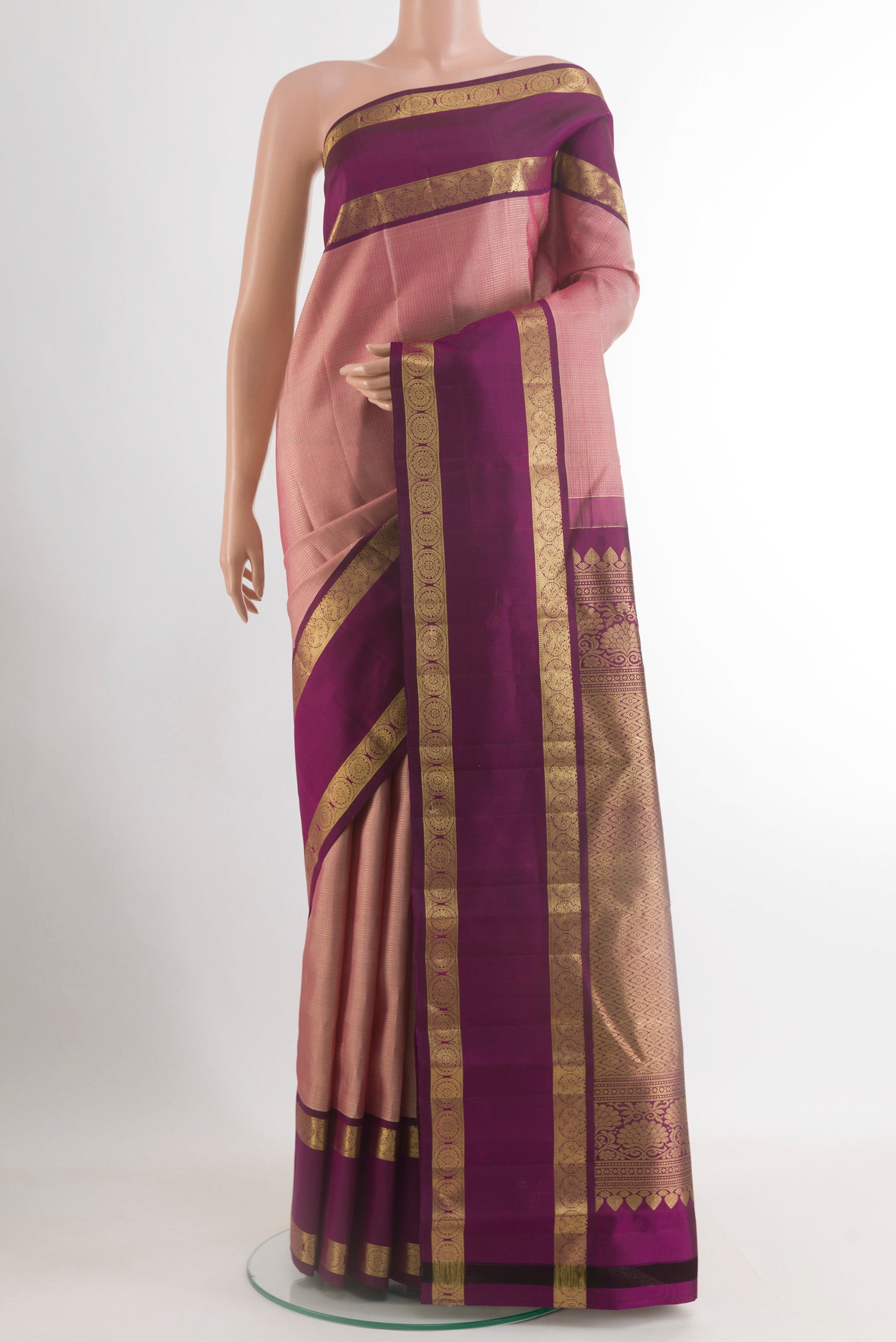Pink Kanchipuram Silk Saree with Stripes on the body and Zari Border.  displayed on a mannequin