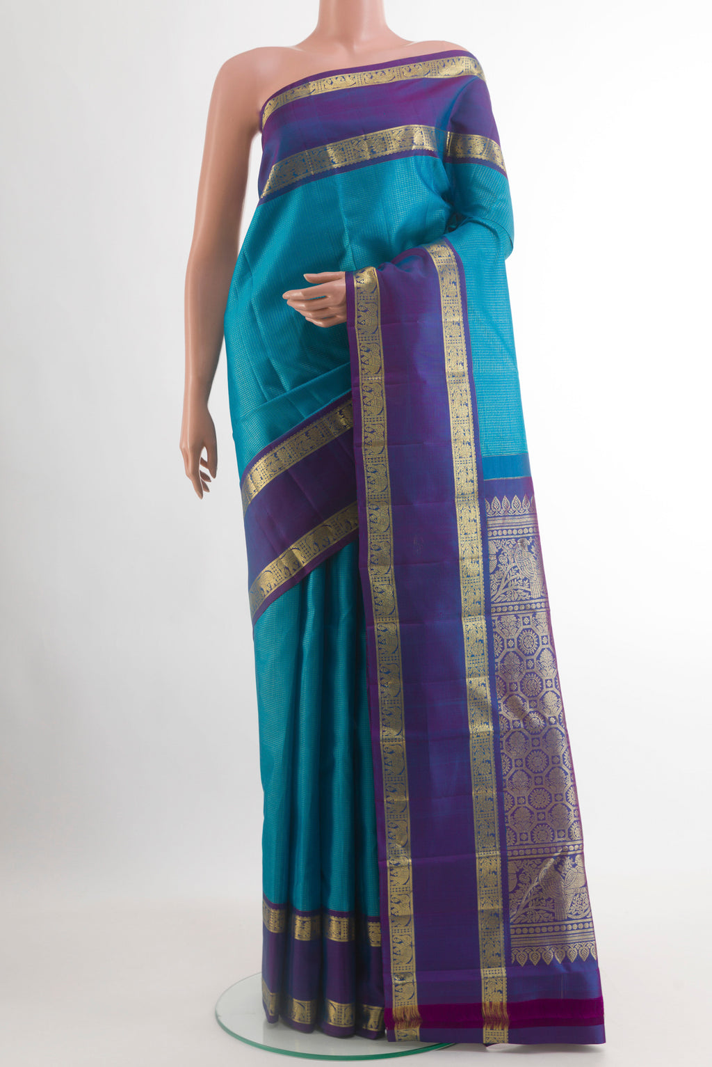 Blue Kanchipuram Silk Saree with Checked design on the body and Zari Border.  displayed on a mannequin