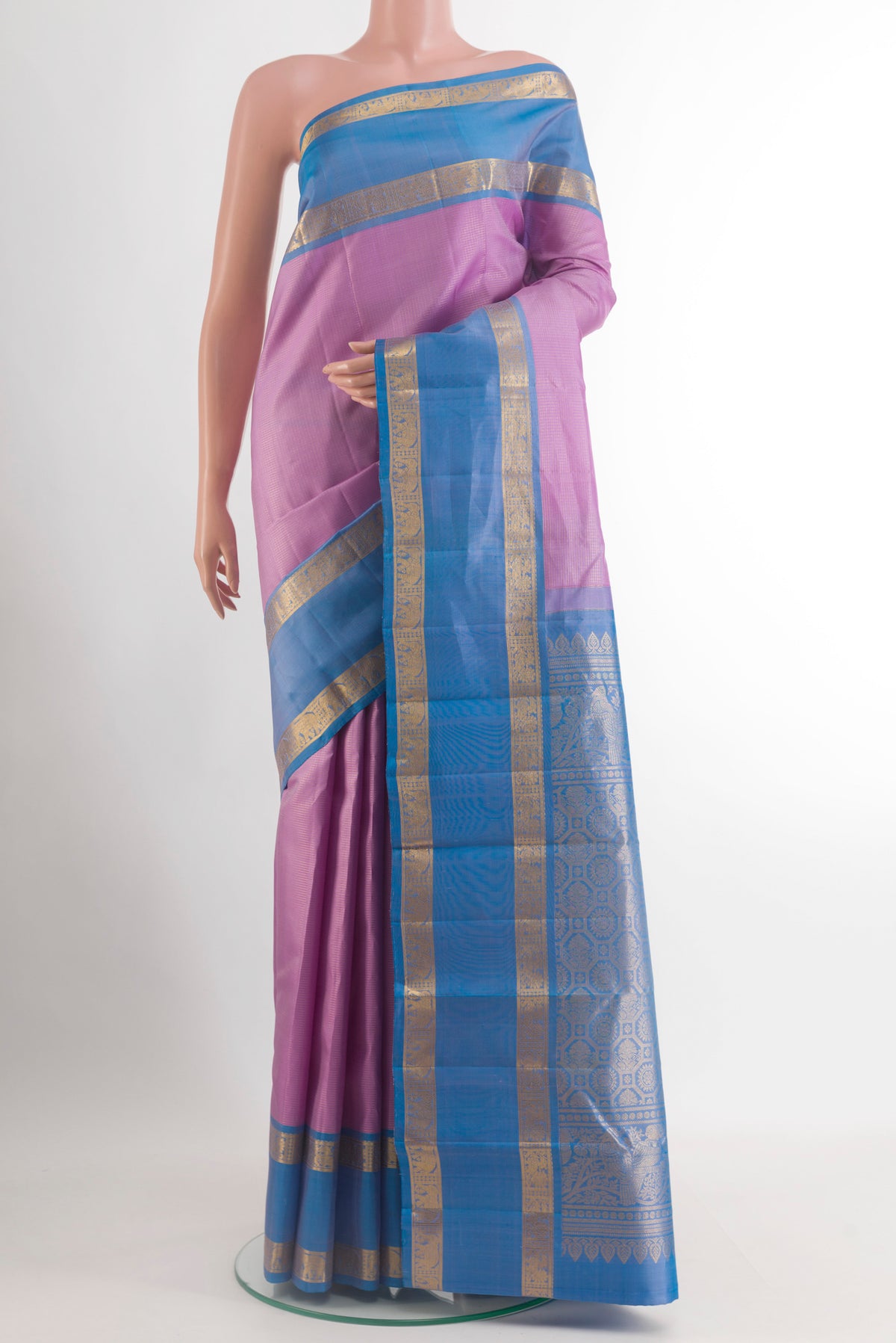 Lavender Kanchipuram Silk Saree with Checked design on the body and Zari Border.  displayed on a mannequin