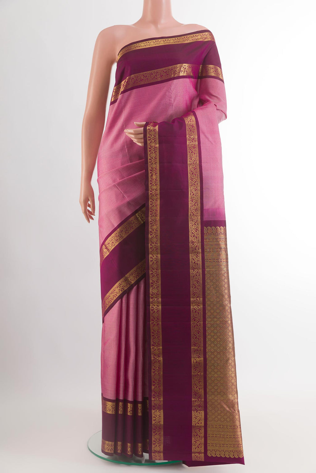 Pink Kanchipuram Silk Saree with Checked design on the body and Zari Border.  displayed on a mannequin
