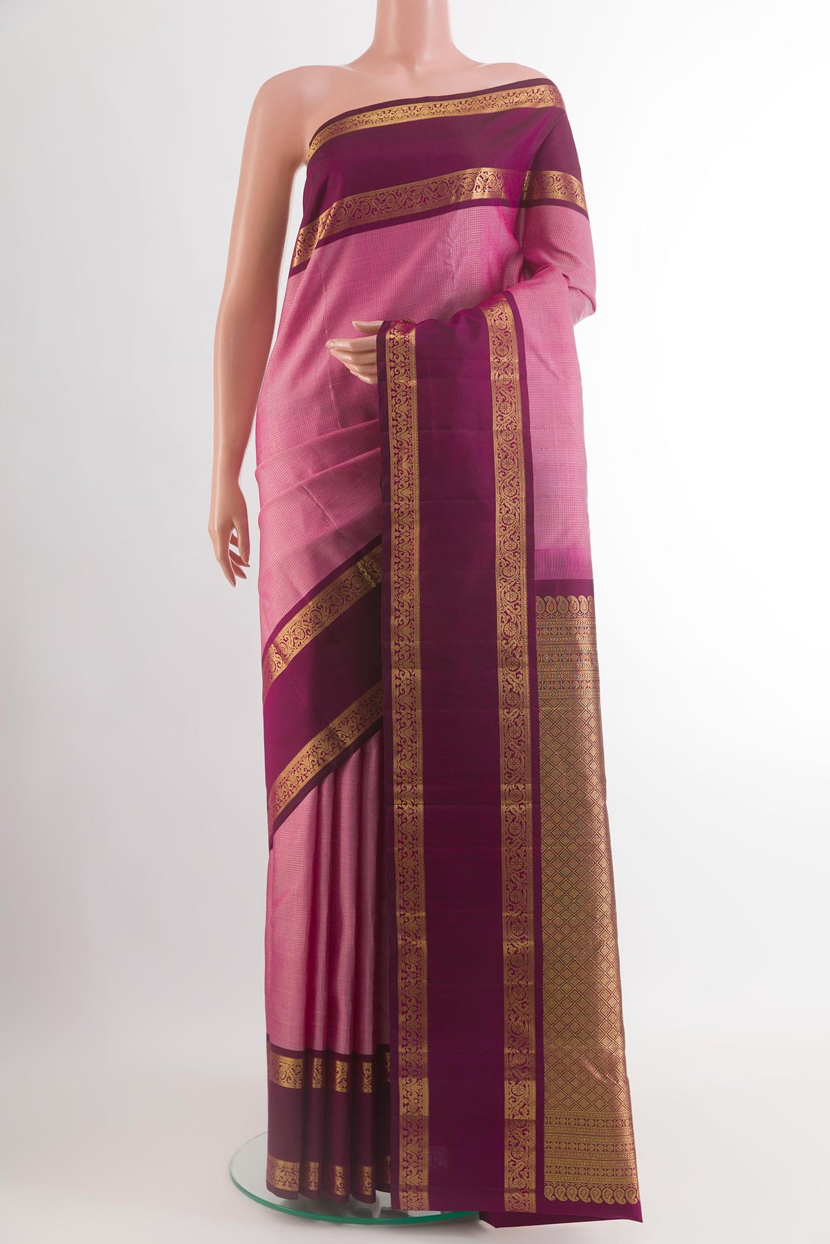 Pink Kanchipuram Silk Saree with Checked design on the body and Zari Border.  displayed on a mannequin