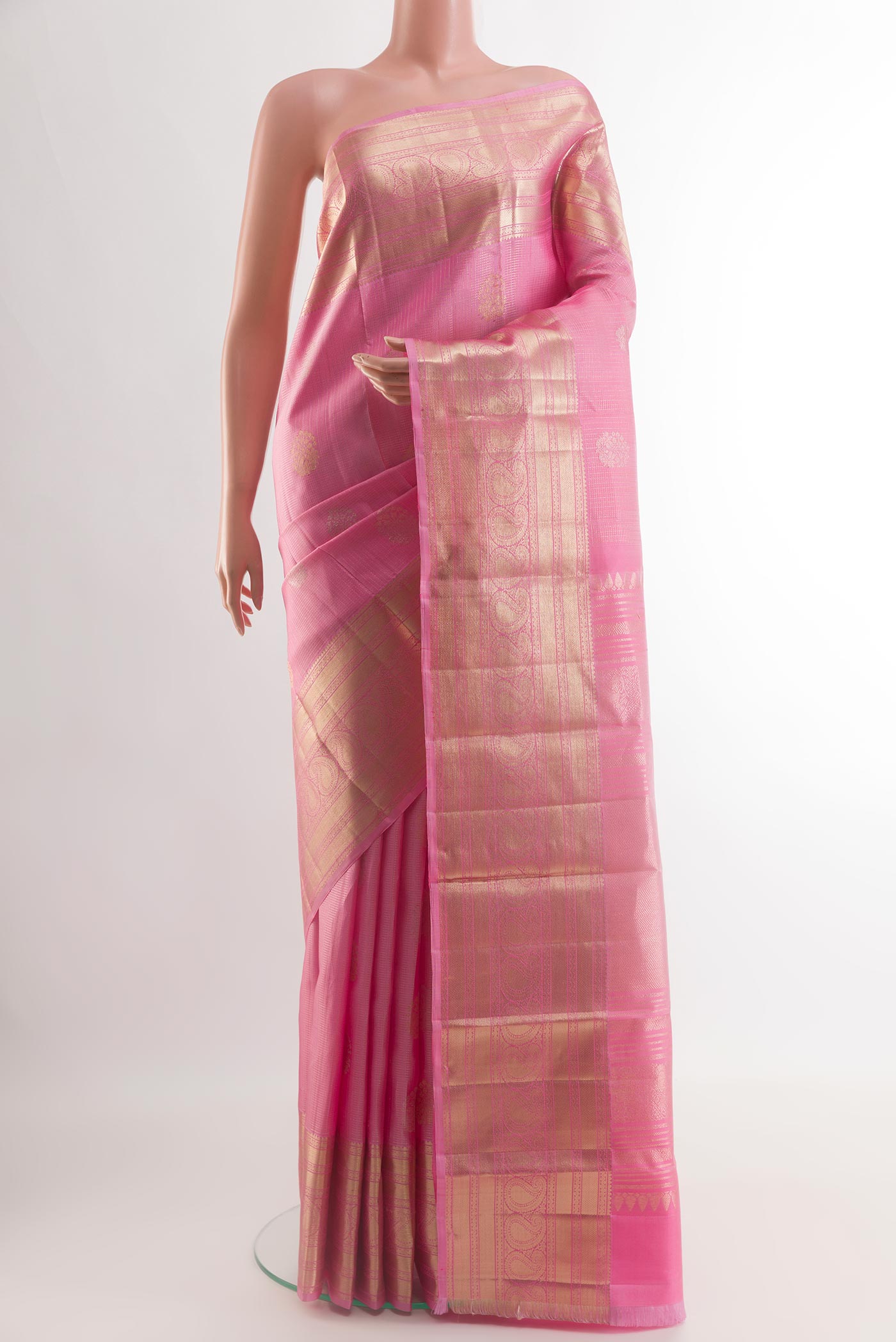 Rose pink Kanjivaram Silk Saree with Zari Butta on the body and Zari Border.  displayed on a mannequin