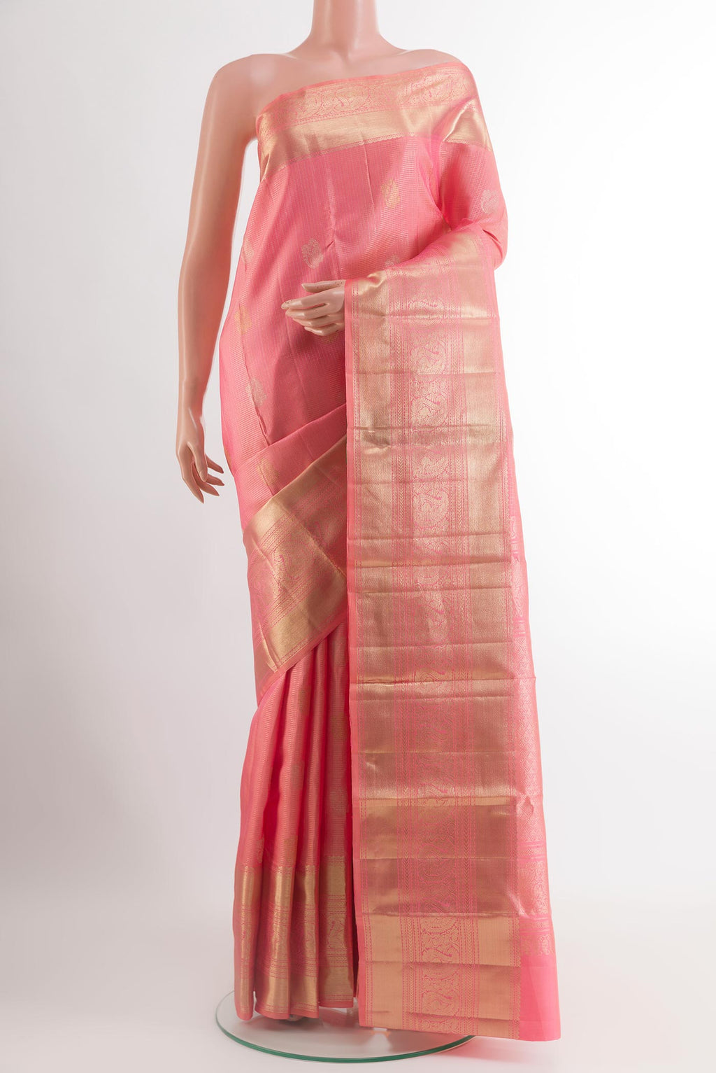 Rose pink Kanjivaram Silk Saree with Checked design on the body and Zari Border.  displayed on a mannequin