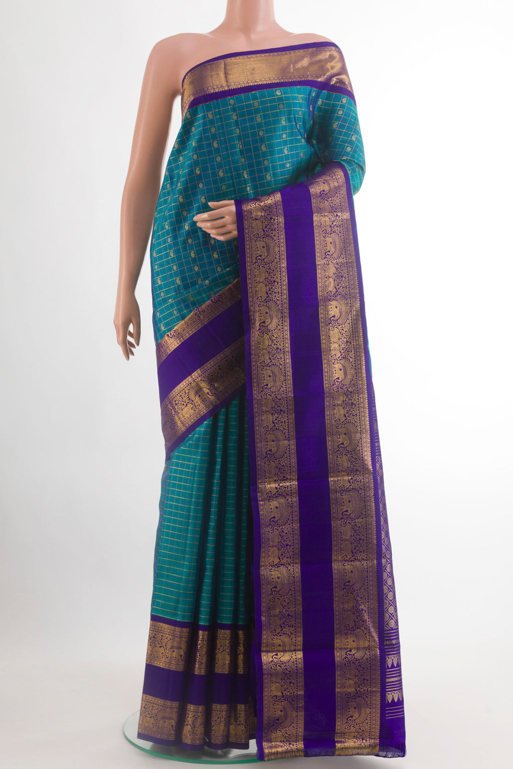 Peacock Blue Kanjivaram Silk Saree with Checked design on the body and Zari Border.  displayed on a mannequin
