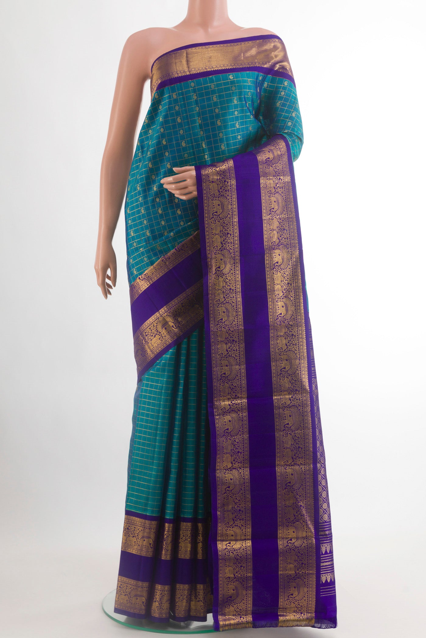 Peacock Blue Kanjivaram Silk Saree with Checked design on the body and Zari Border.  displayed on a mannequin