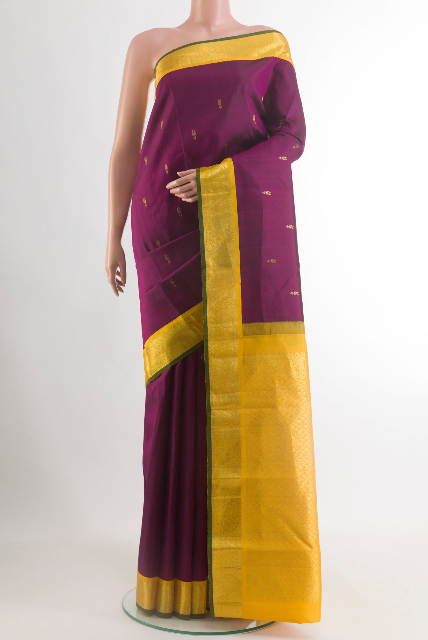 Purple Kanjivaram Silk Saree with Zari Butta on the body and Zari Border.  displayed on a mannequin