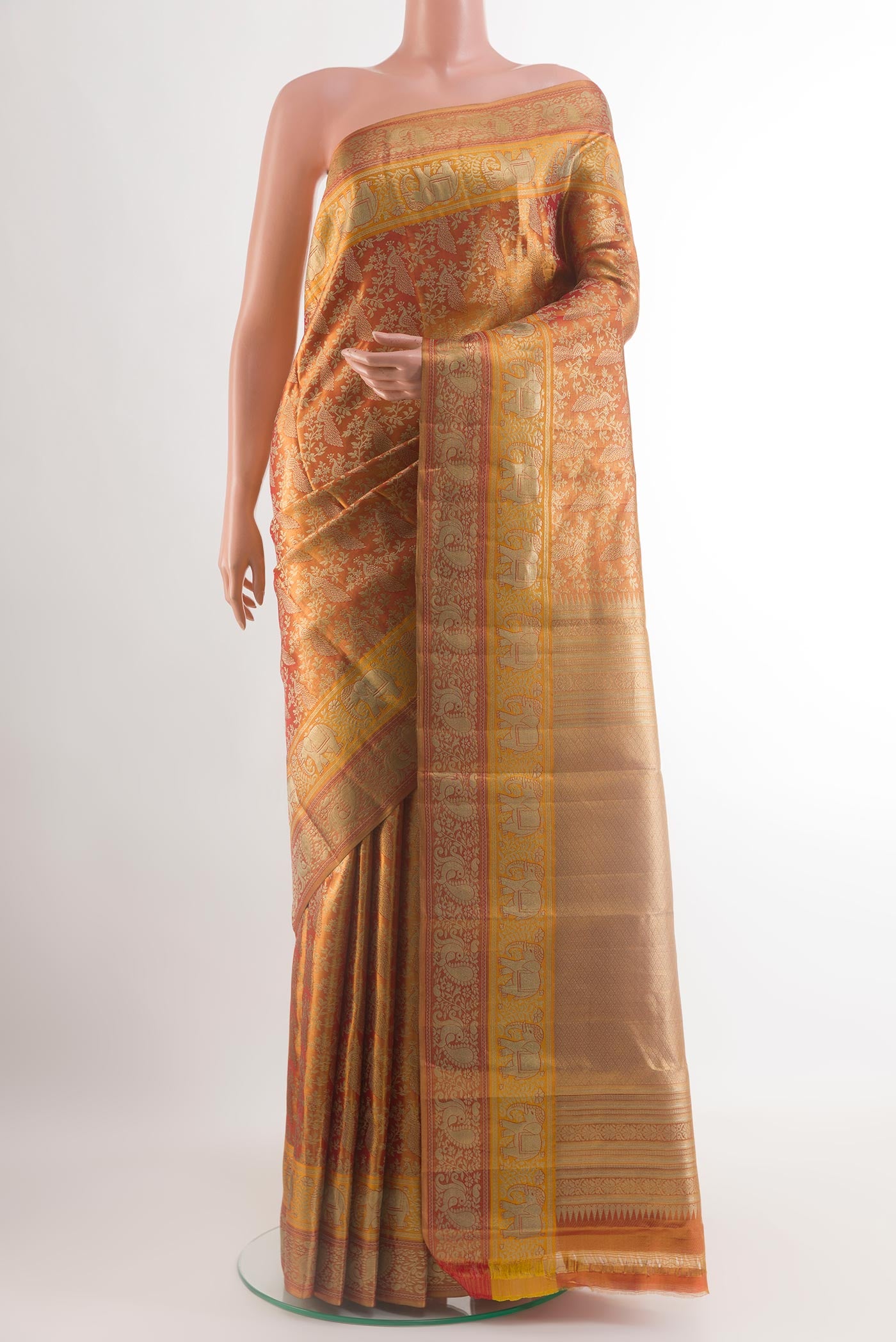 Golden Dual Tone Kanchipuram Tissue Silk Saree with Zari Brocade on the body and Zari Border.  displayed on a mannequin