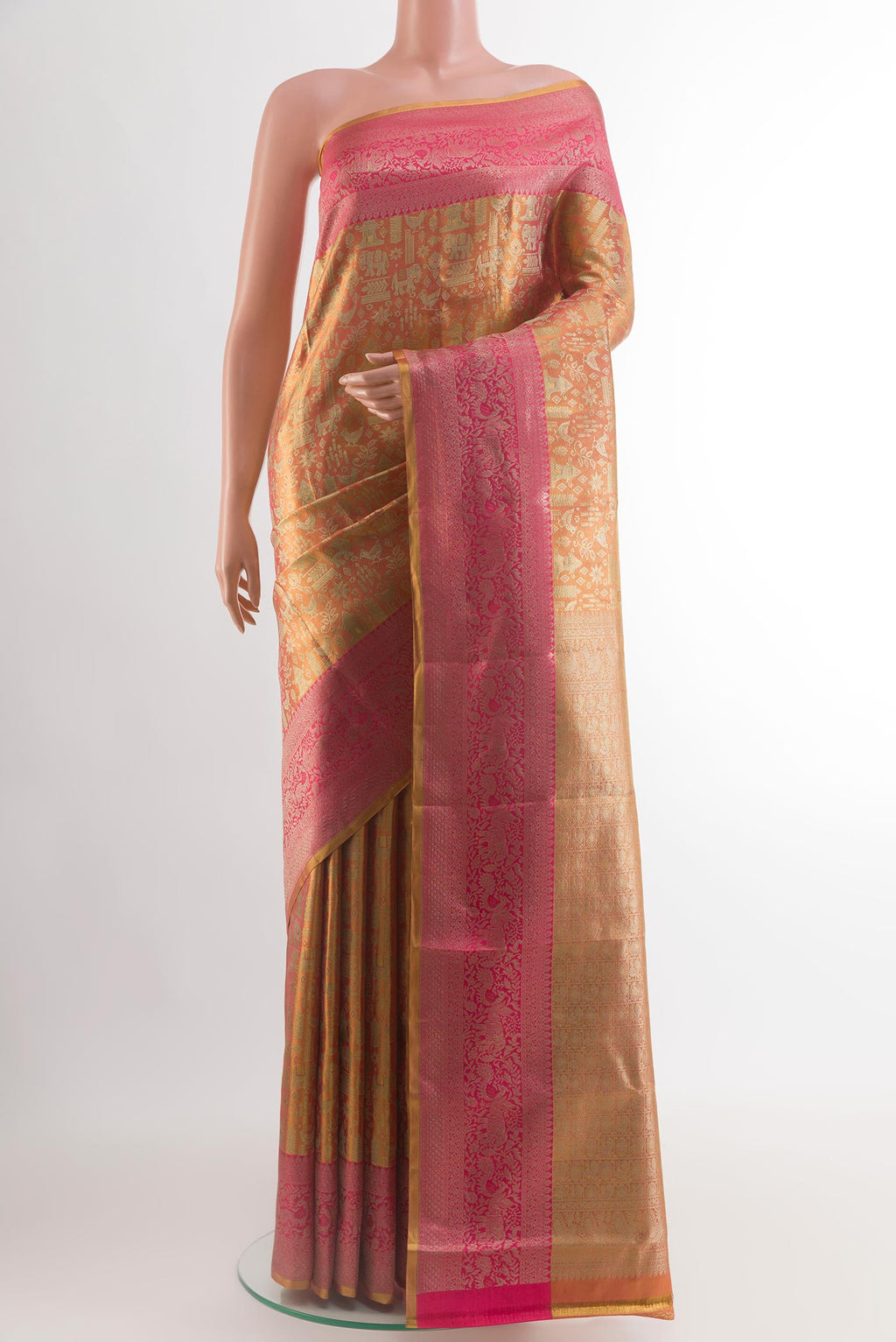 Gold Dual Tone Kanchipuram Tissue Silk Saree with Zari Brocade on the body and Zari Border.  displayed on a mannequin