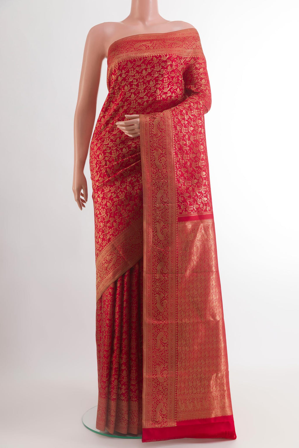 Red Kanchipuram Silk Saree with Zari Brocade on the body and Zari Border.  displayed on a mannequin