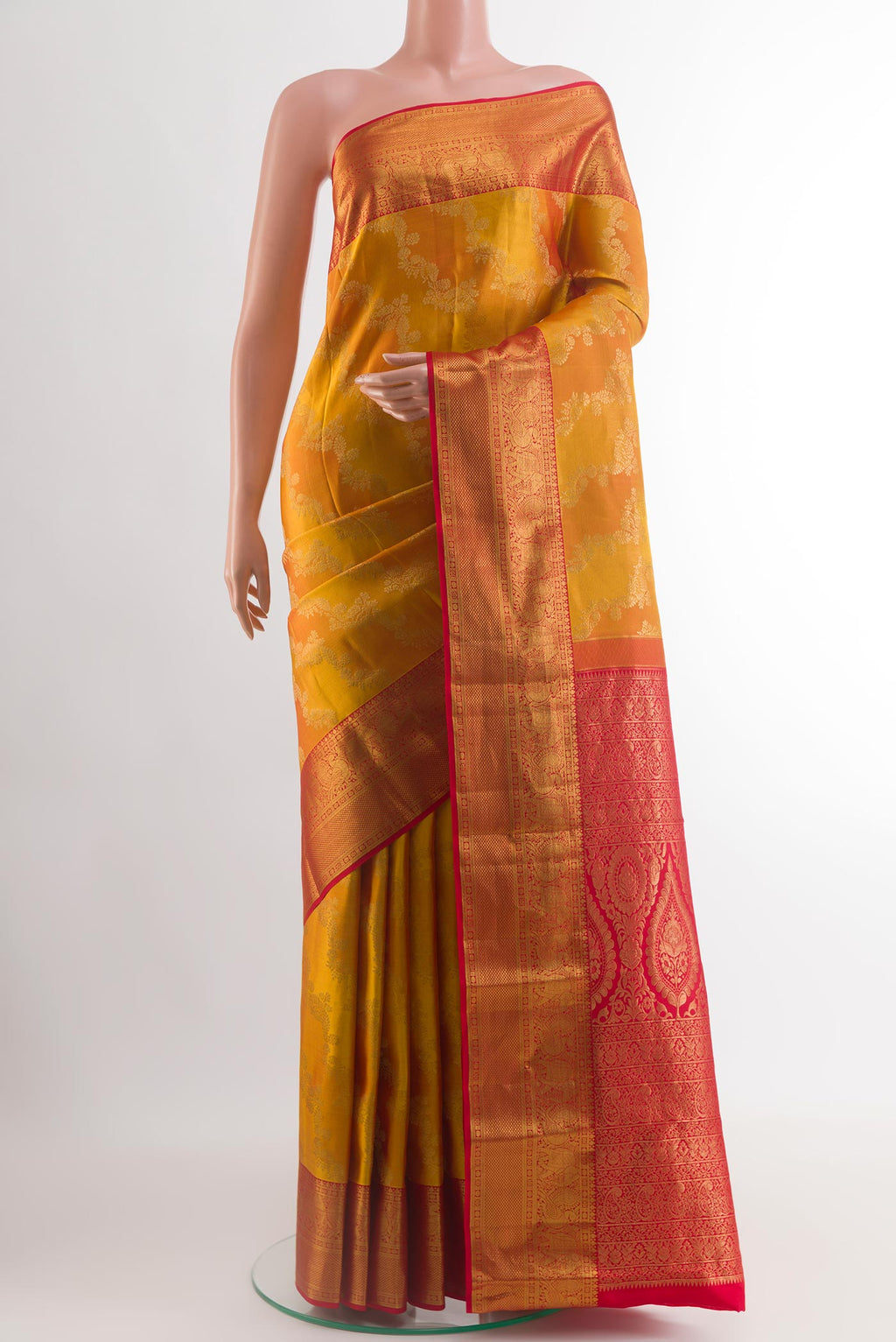 Yellow Kanchipuram Silk Saree with Zari Brocade on the body and Zari Border.  displayed on a mannequin