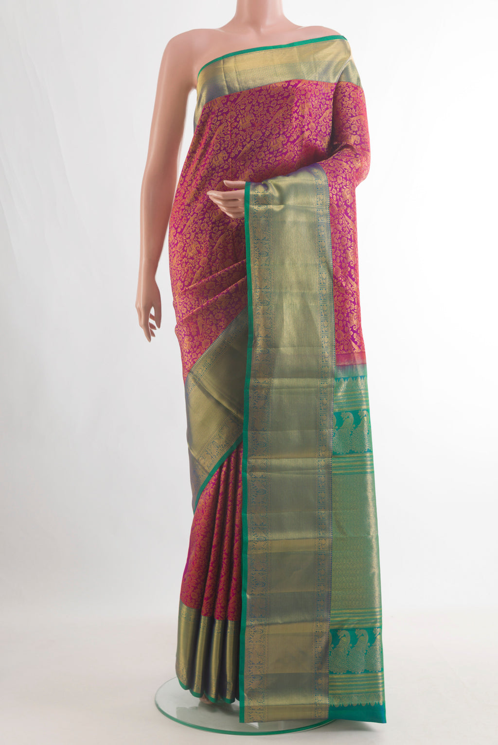 Pure Silk Pink Kanchipuram Saree with Zari Brocade on the body and Zari Border.  displayed on a mannequin