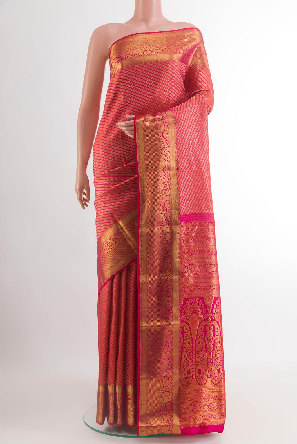 Pink Kanchipuram Silk Saree with Zari Brocade on the body and Zari Border.  displayed on a mannequin