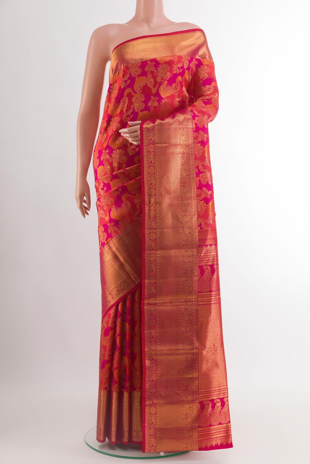 Pink Kanchipuram Silk Saree with Zari Brocade on the body and Zari Border.  displayed on a mannequin