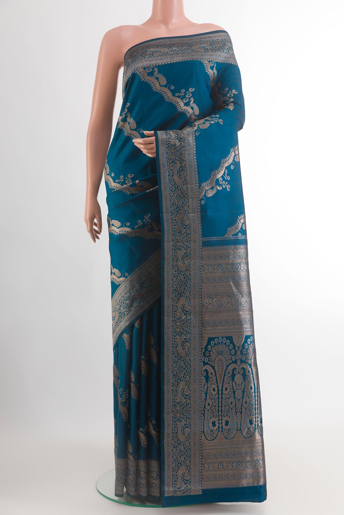Blue Kanjivaram Silk Saree with Zari Butta on the body and Zari Border.  displayed on a mannequin
