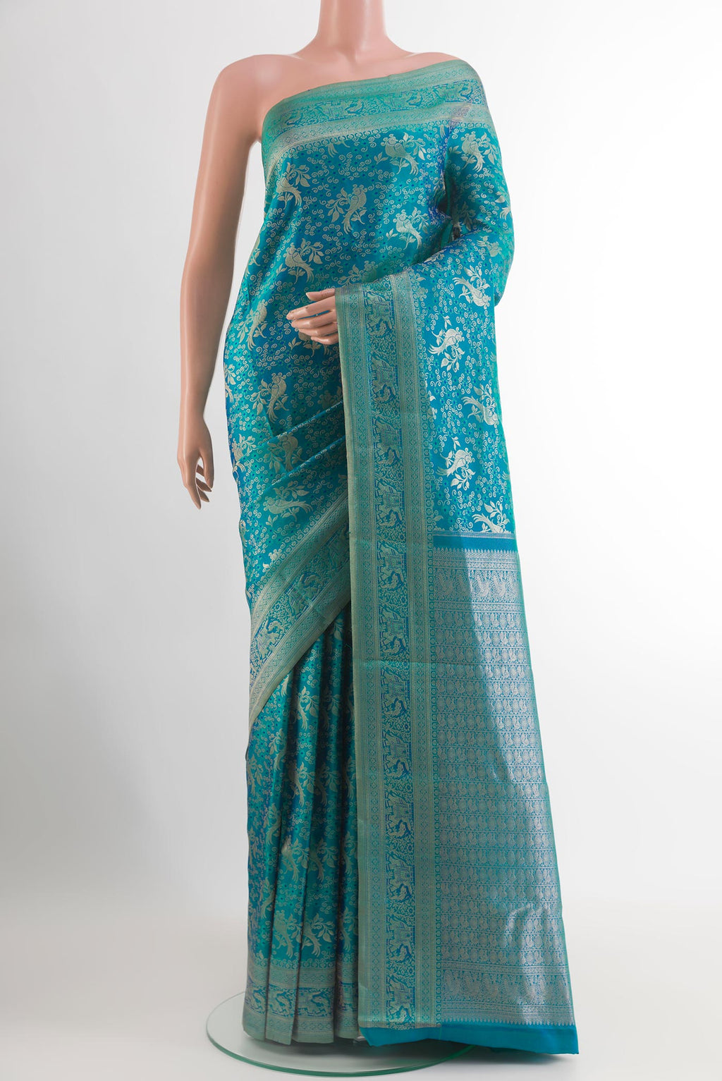 Peacock Blue Kanjivaram Silk Saree with Zari Brocade on the body and Zari Border.  displayed on a mannequin