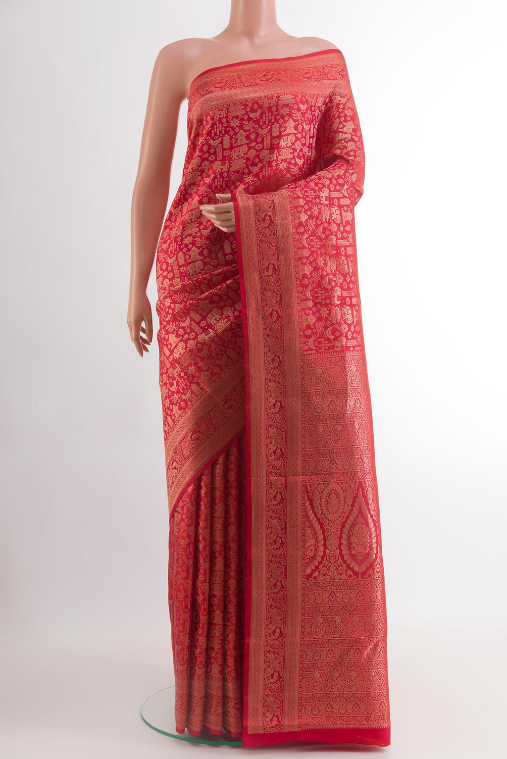 Red Kanjivaram Silk Saree with Zari Brocade on the body and Zari Border.  displayed on a mannequin