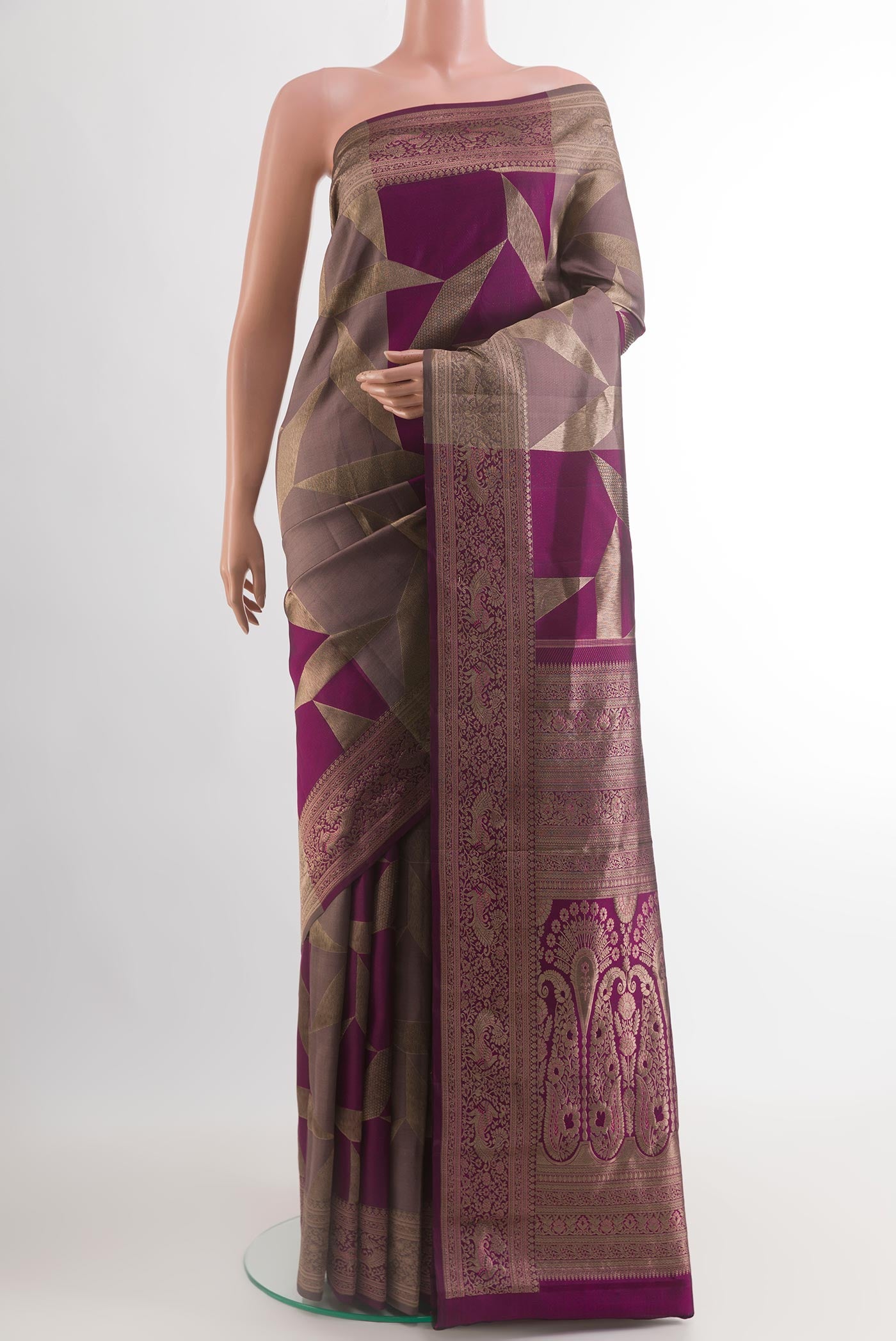 Multi Color Kanjivaram Silk Saree with Zari Butta on the body and Zari Border.  displayed on a mannequin
