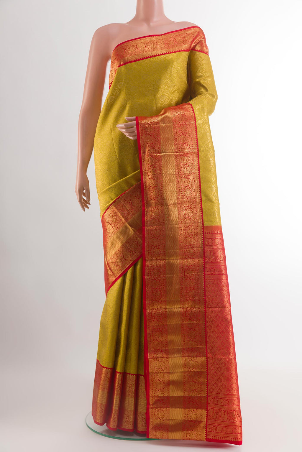 Yellow Kanchipuram Silk Saree with Zari Brocade on the body and Zari Border.  displayed on a mannequin