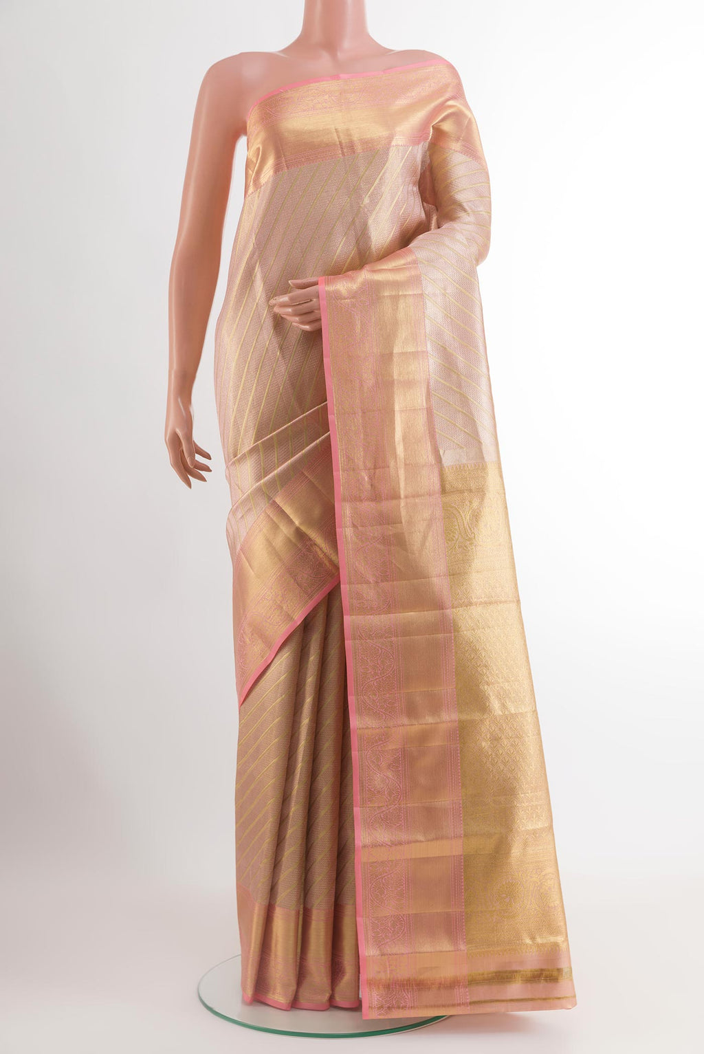 Rose Gold Kanchipuram Tissue Silk Saree with Zari Brocade on the body and Zari Border.  displayed on a mannequin