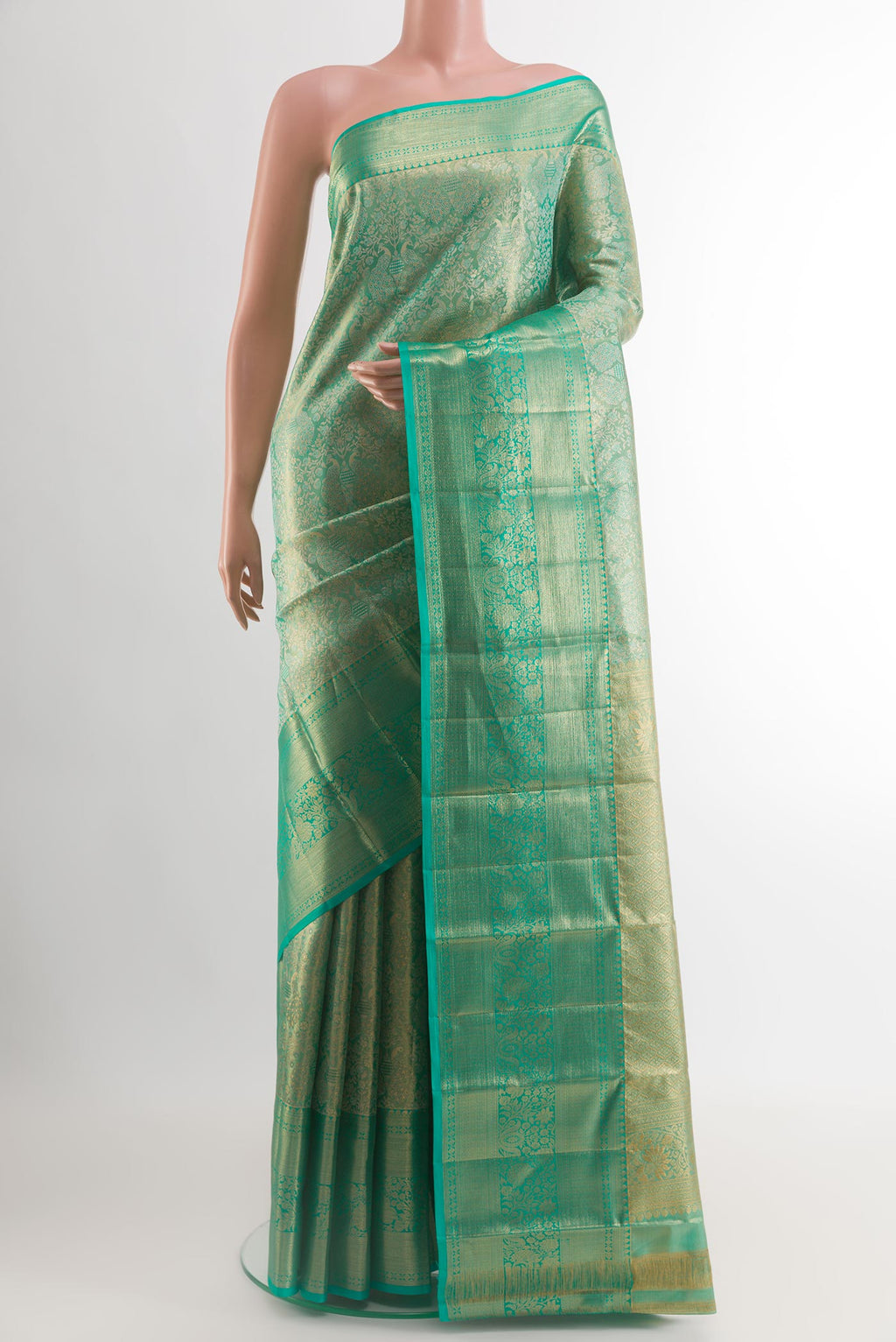 Sea Green Dual Tone Kanchipuram Tissue Silk Saree with Zari Brocade on the body and Zari Border.  displayed on a mannequin