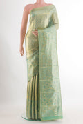Gold Dual Tone Kanchipuram Tissue Saree with Zari Brocade on the body and Zari Border.  displayed on a mannequin