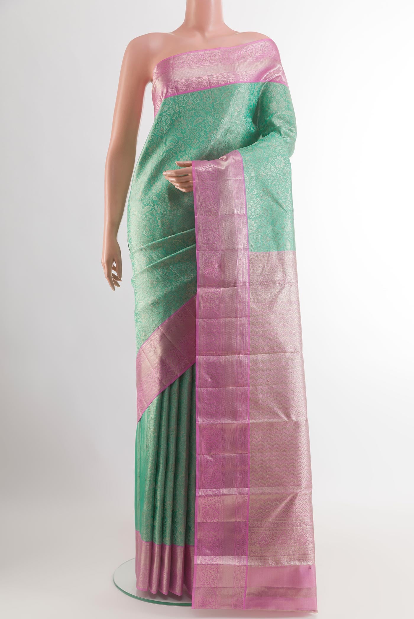 Sea Green Kanchipuram Tissue Silk Saree with Zari Brocade on the body and Zari Border.  displayed on a mannequin