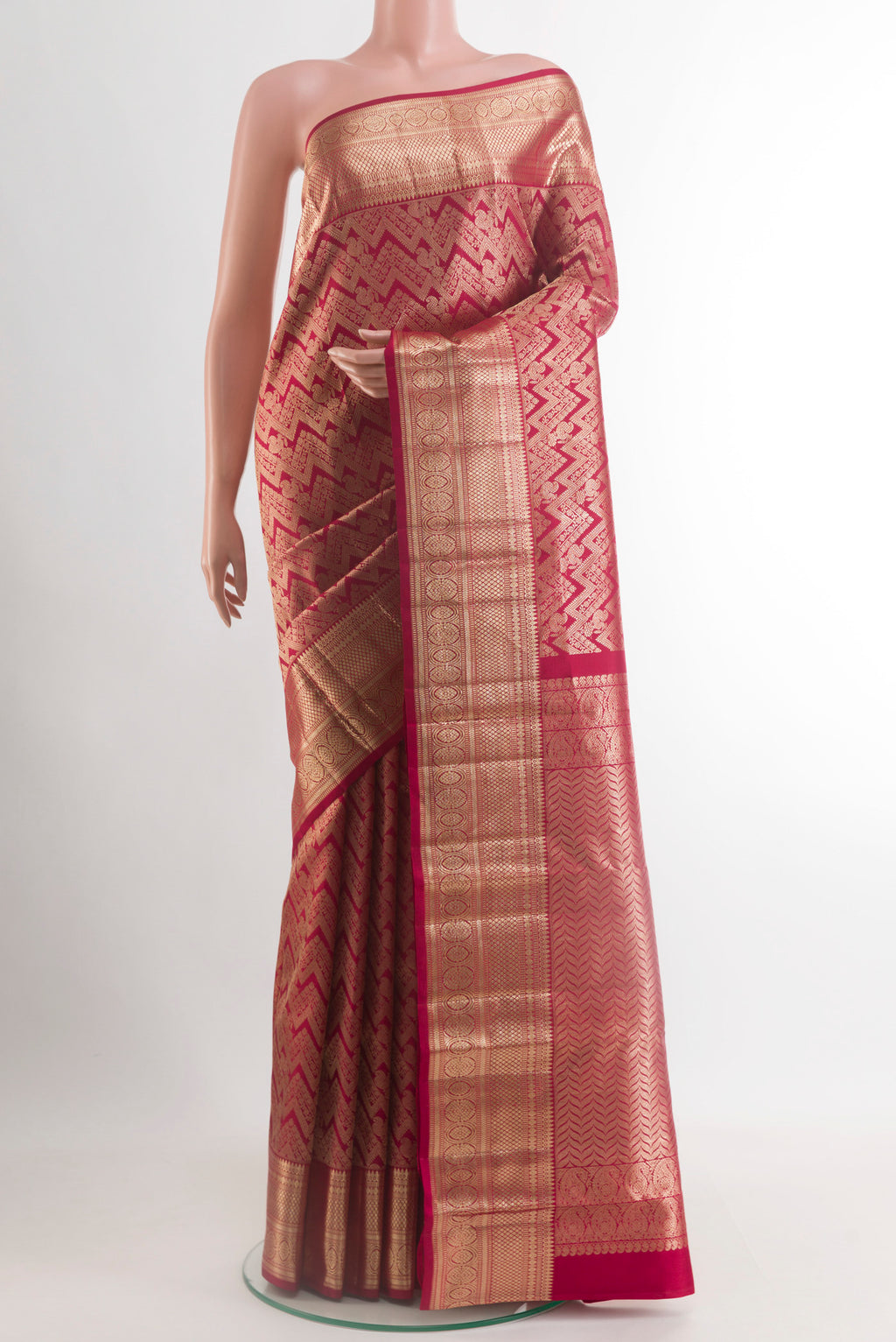 Maroon Kanchipuram Silk Saree with Zari Brocade on the body and Zari Border.  displayed on a mannequin