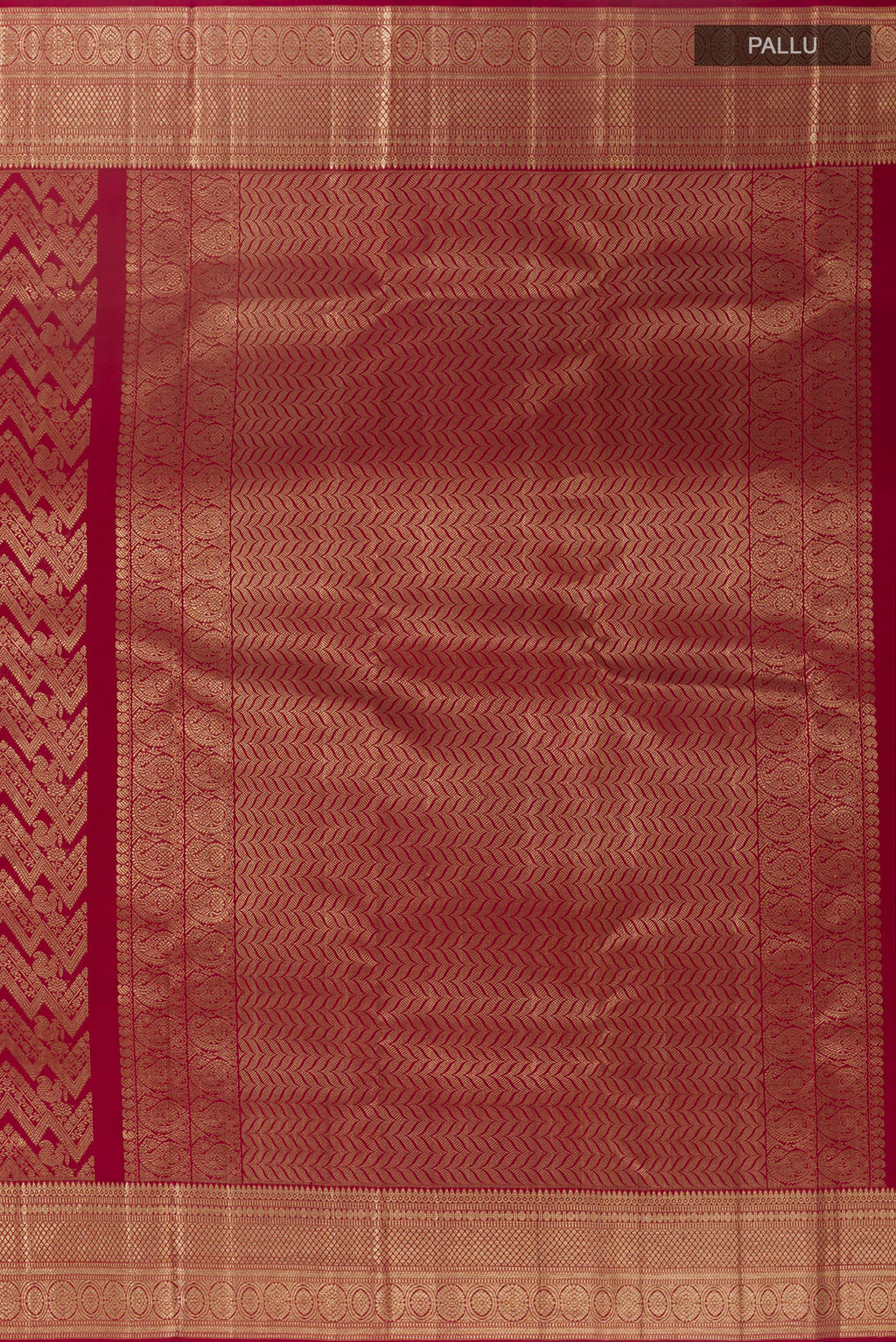 Close up image of the pallu of Maroon Kanchipuram Silk Saree with Zari Brocade on the body and Zari Border. 
