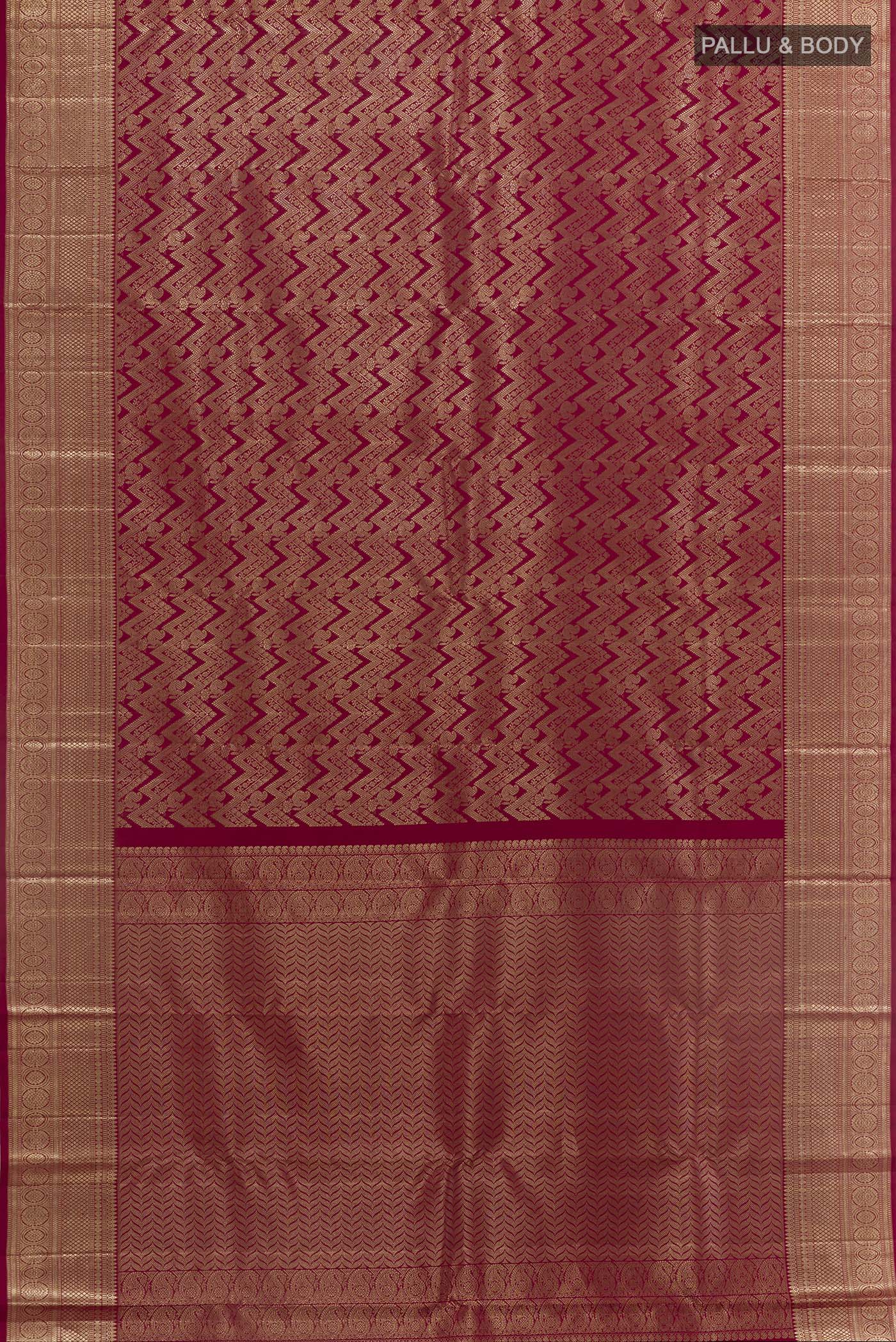 Flat view of Maroon Kanchipuram Silk Saree with Zari Brocade on the body and Zari Border. 