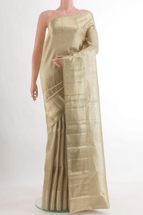 Beige Kanchipuram Silk Saree with Zari Brocade on the body and Zari Border.  displayed on a mannequin