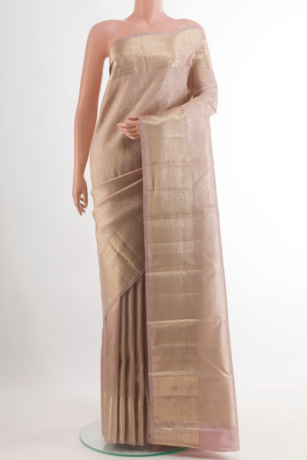 Lavender Kanchipuram Silk Saree with Zari Brocade on the body and Zari Border.  displayed on a mannequin