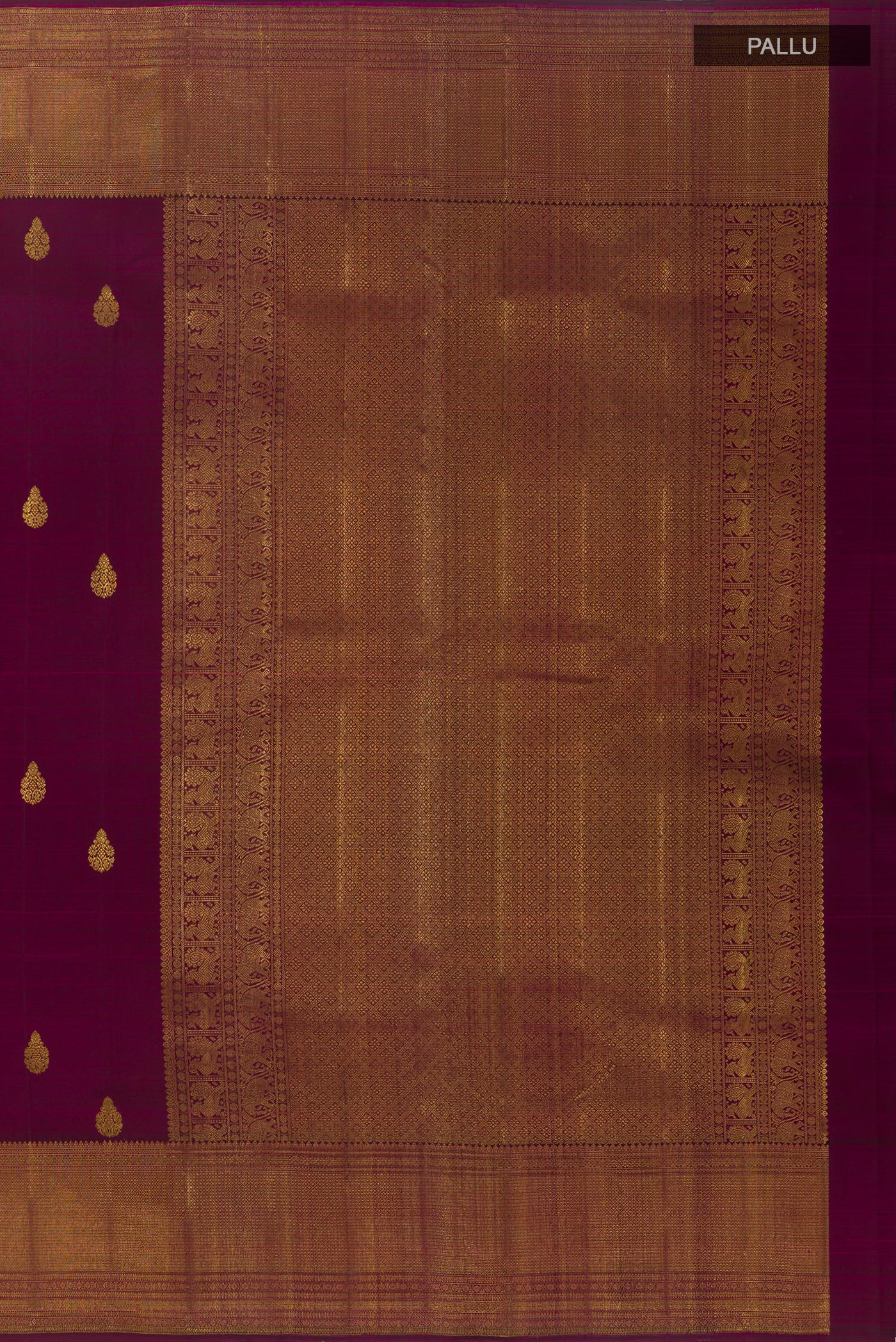 Close up image of the pallu of Purple Kanchipuram Silk Saree with Zari Butta on the body and Zari Border. 