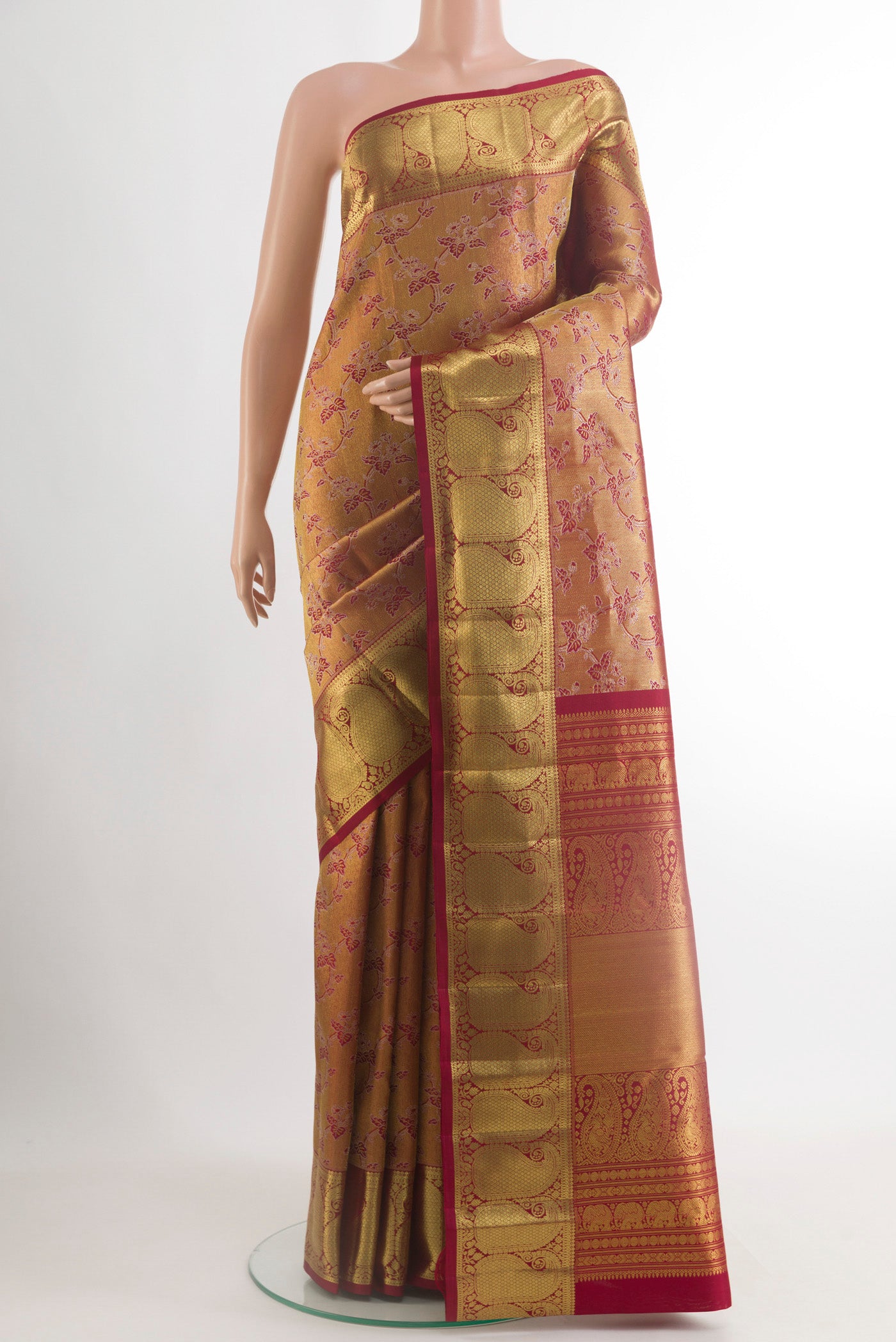 Maroon Kanchipuram Tissue Silk Saree with Zari Brocade on the body and Zari Border.  displayed on a mannequin