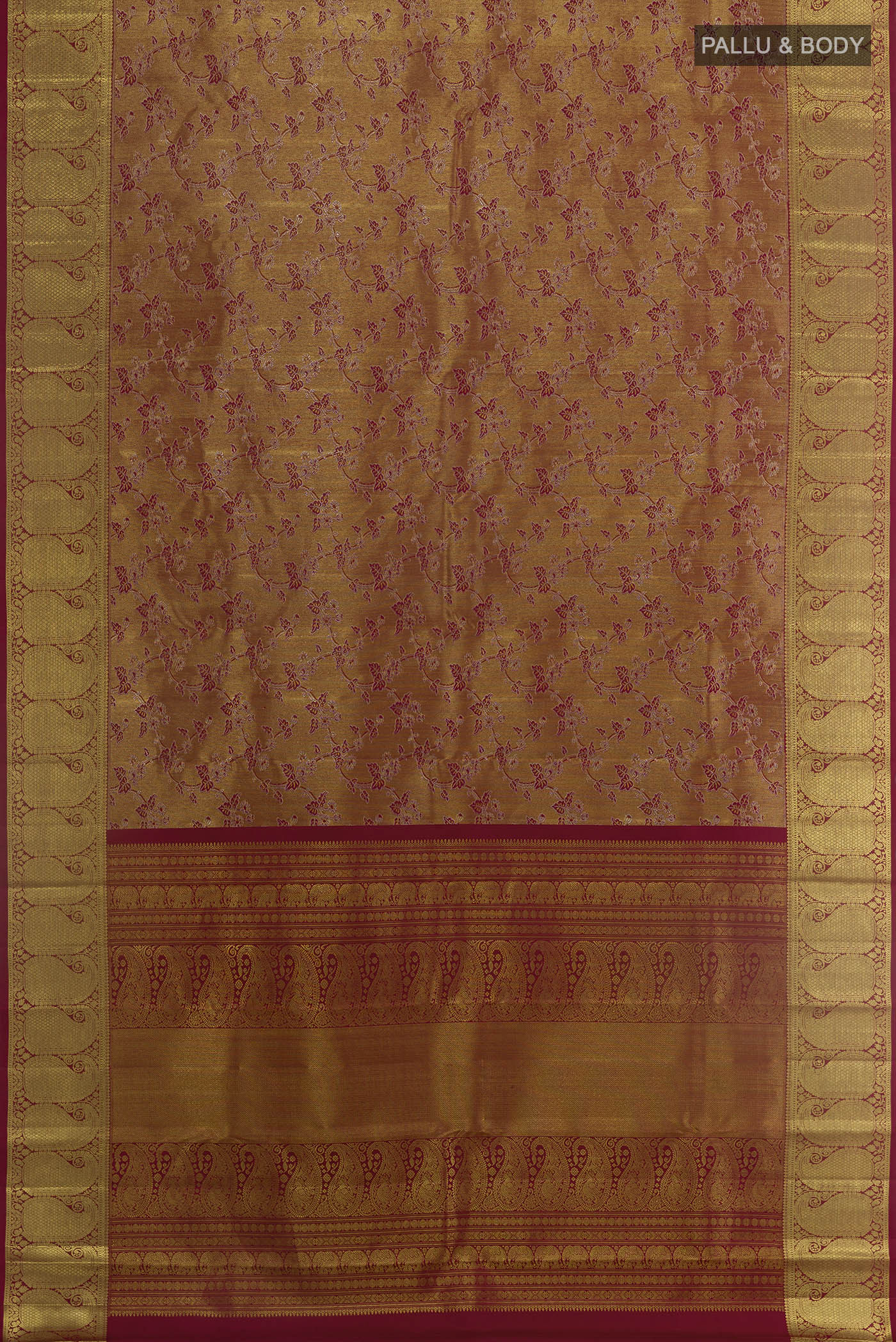 Flat view of Maroon Kanchipuram Tissue Silk Saree with Zari Brocade on the body and Zari Border. 