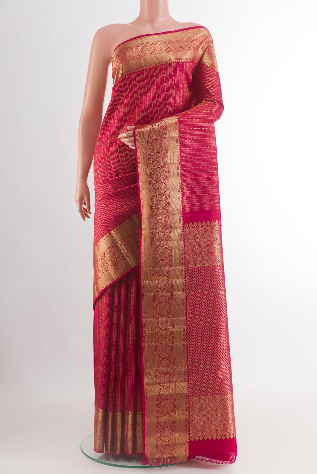 Dark Pink Kanjivaram Silk Saree with Stripes on the body and Zari Border.  displayed on a mannequin