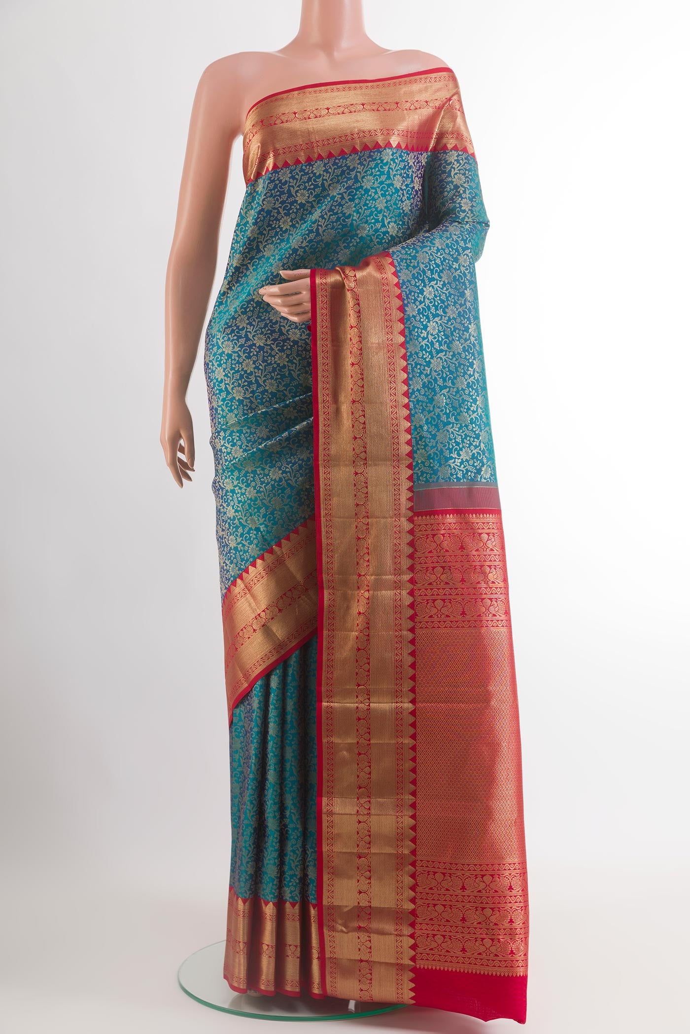 Blue Kanchipuram Silk Saree with Zari Brocade on the body and Zari Border.  displayed on a mannequin
