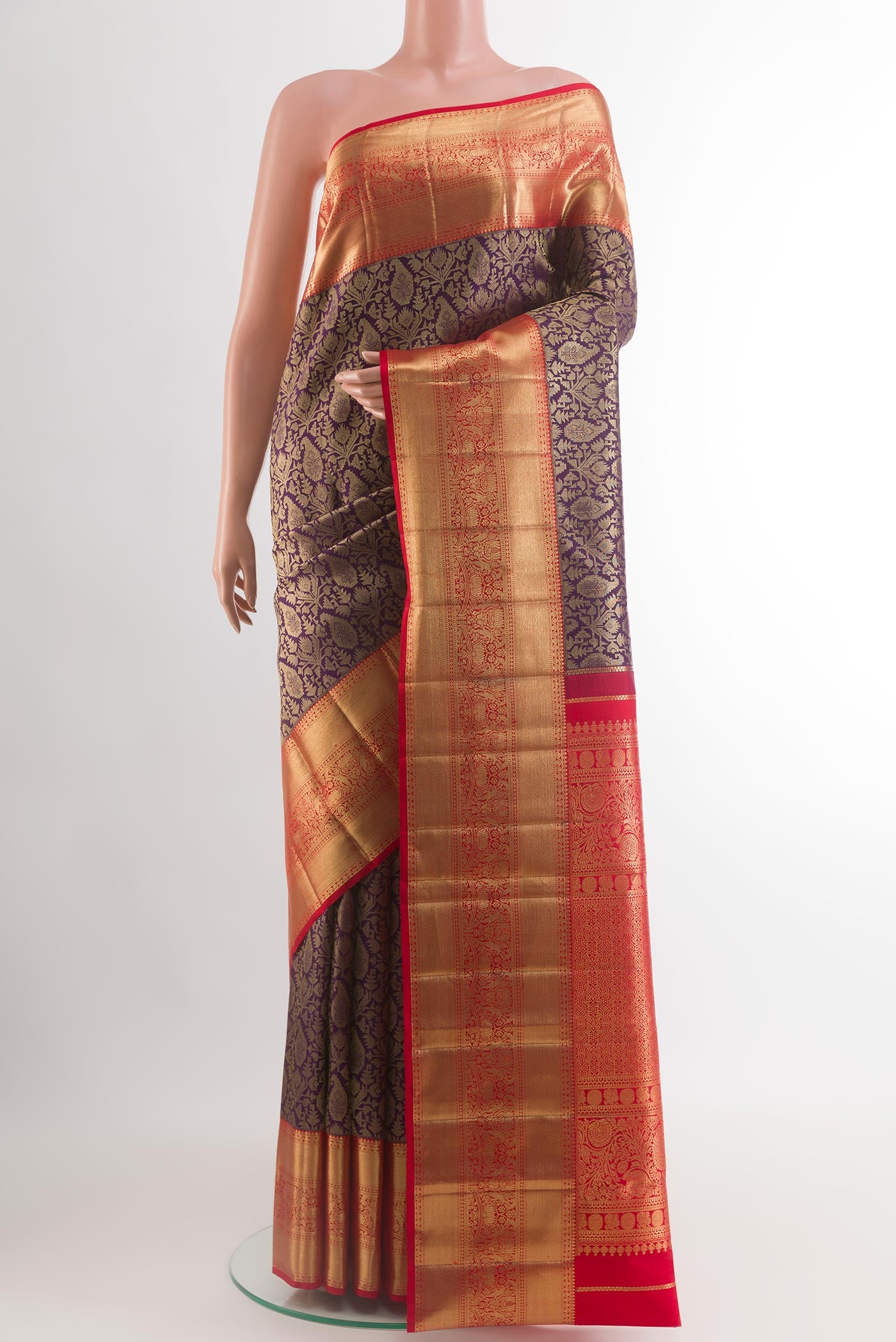 Purple Kanchipuram Silk Saree with Zari Brocade on the body and Zari Border.  displayed on a mannequin