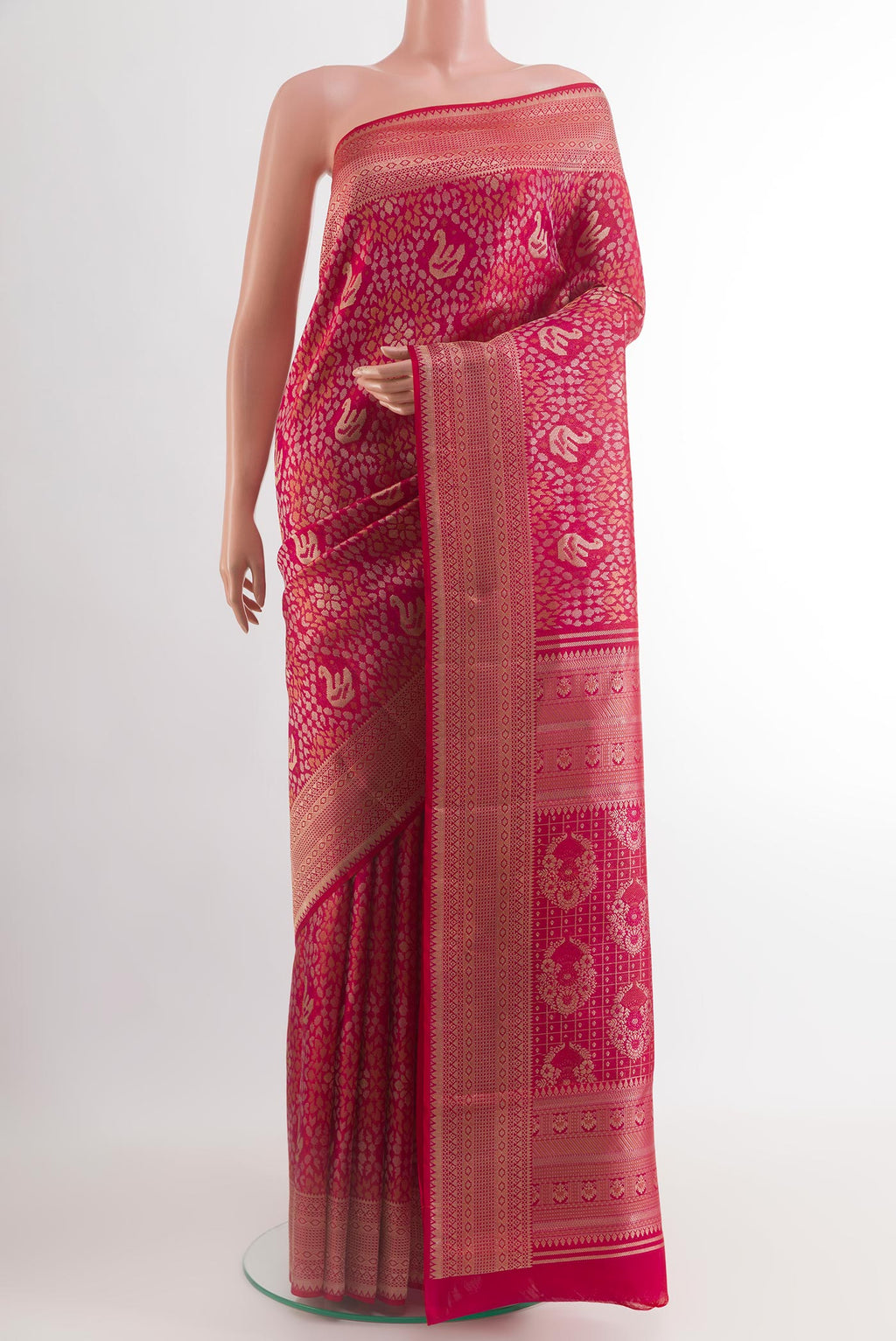 Dark Pink Kanchipuram Silk Saree with Zari Brocade on the body and Zari Border.  displayed on a mannequin