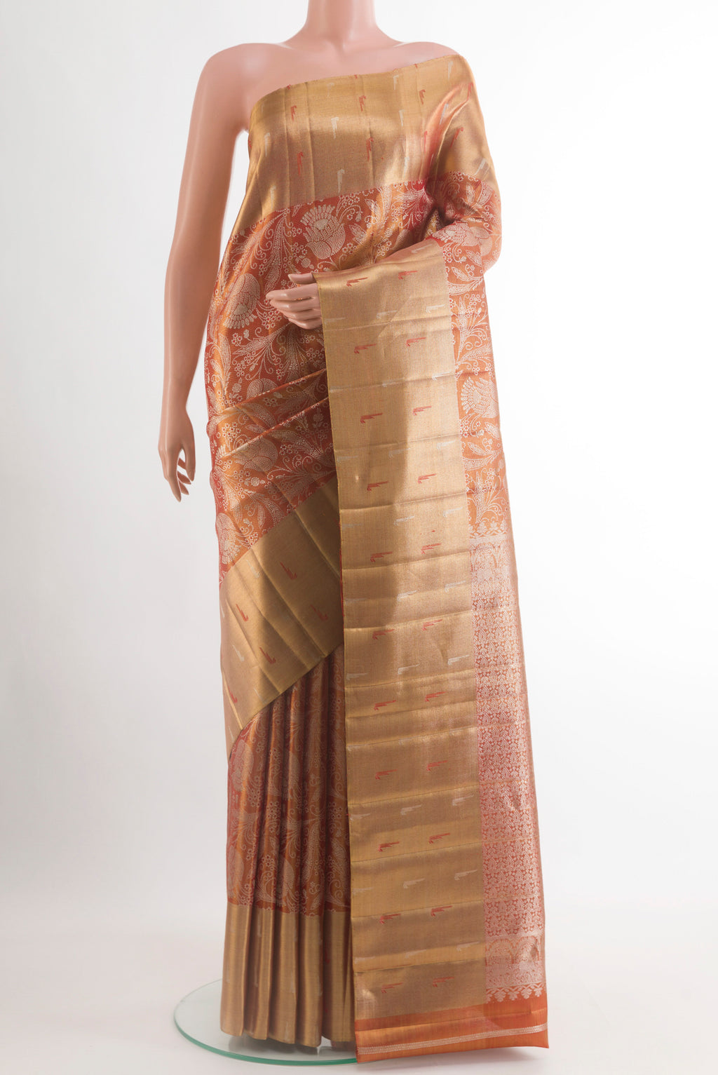Rust Kanjivaram Tissue Silk Saree with Zari Brocade on the body and Zari Border.  displayed on a mannequin