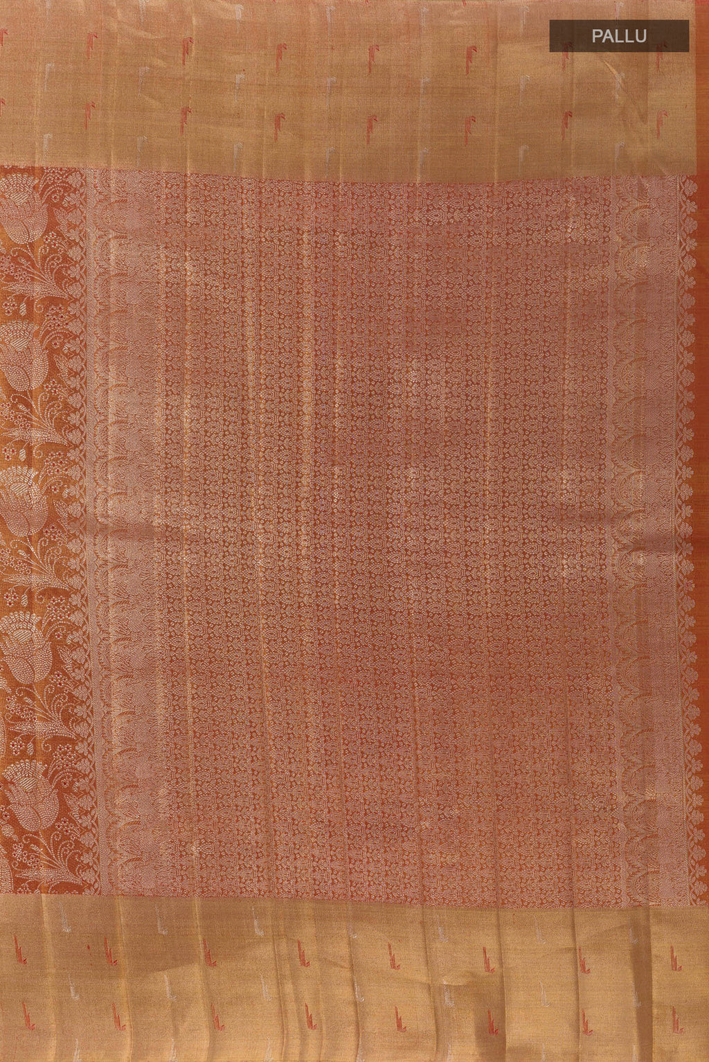 Close up image of the pallu of Rust Kanjivaram Tissue Silk Saree with Zari Brocade on the body and Zari Border. 
