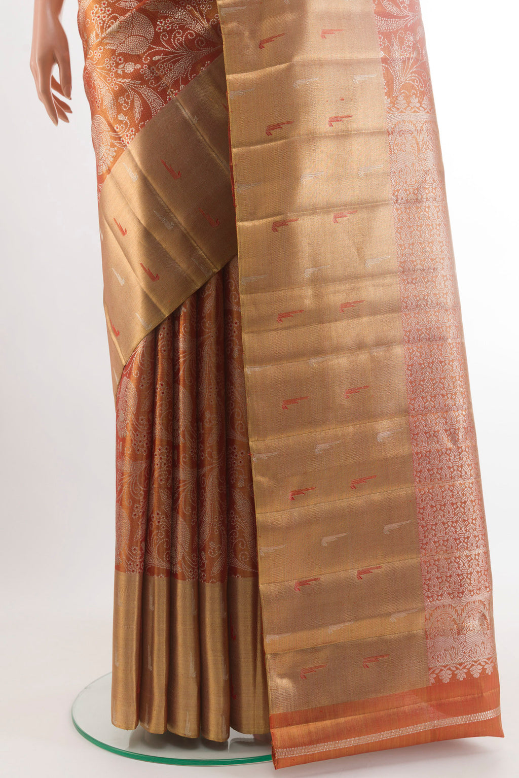 Pleats and pallu of Rust Kanjivaram Tissue Silk Saree with Zari Brocade on the body and Zari Border. 
