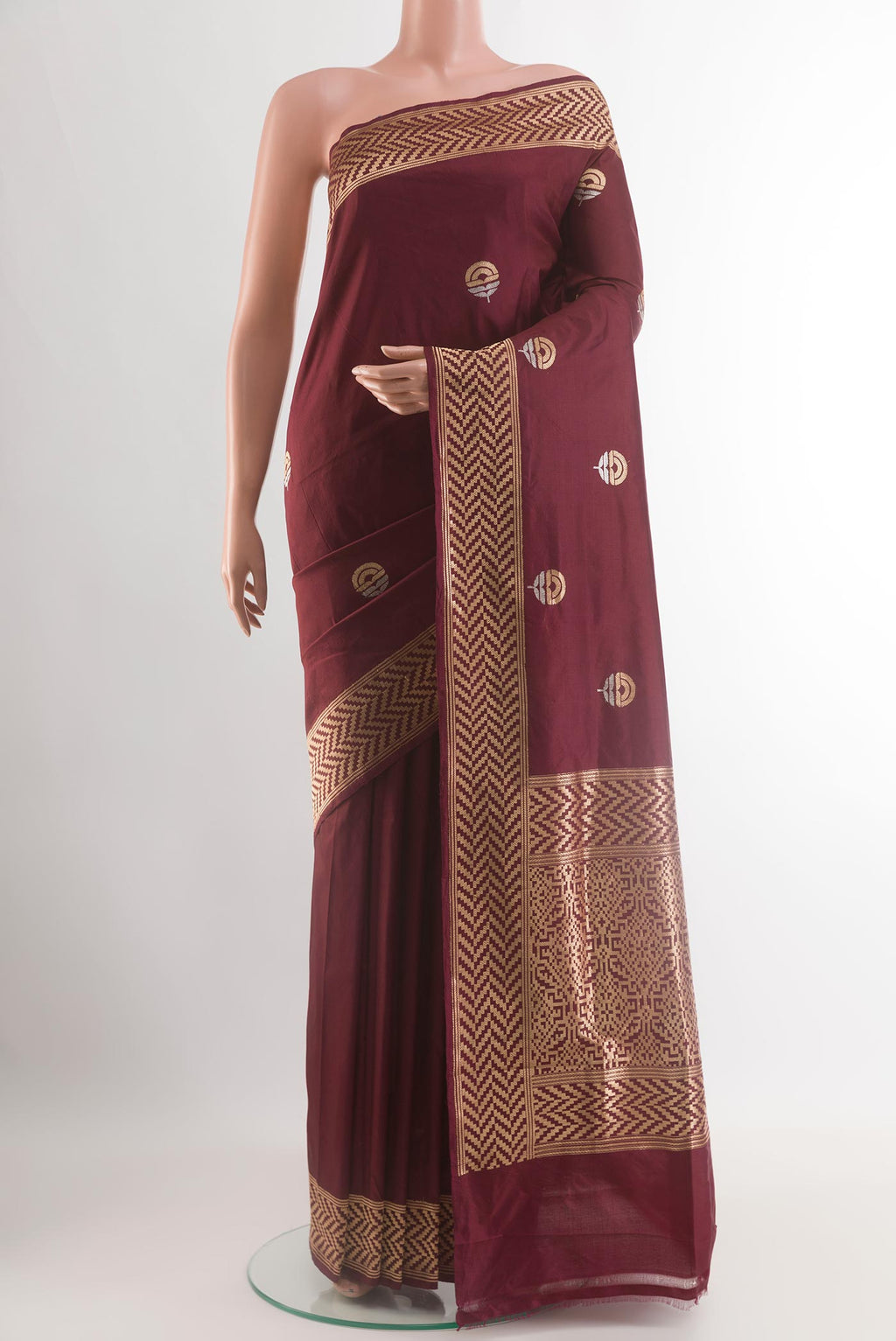 Brown Banarasi Katan Silk Saree with Zari Butta on the body and Zari Border.  displayed on a mannequin