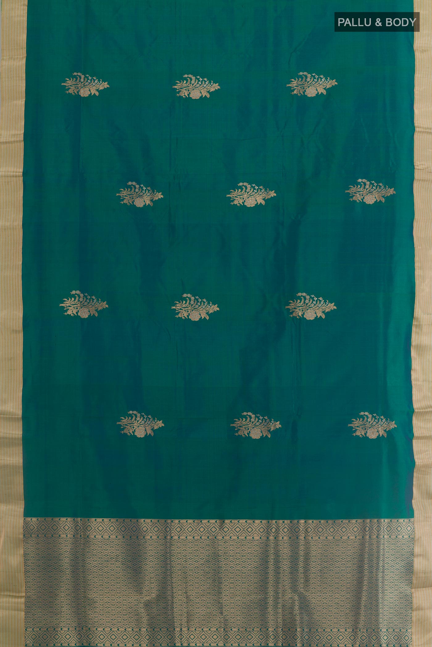 Flat view of Peacock Blue Banarasi Katan Silk Saree with Zari Butta on the body and Zari Border. 