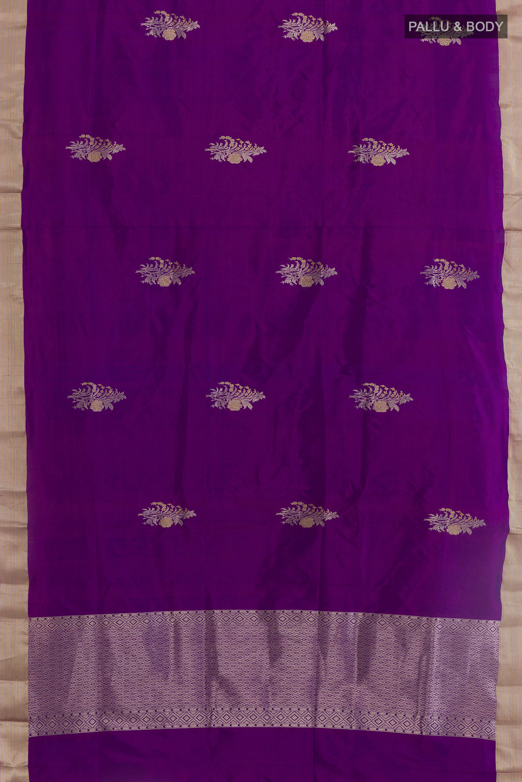 Flat view of Purple Banarasi Katan Silk Saree with Zari Butta on the body and Zari Border. 