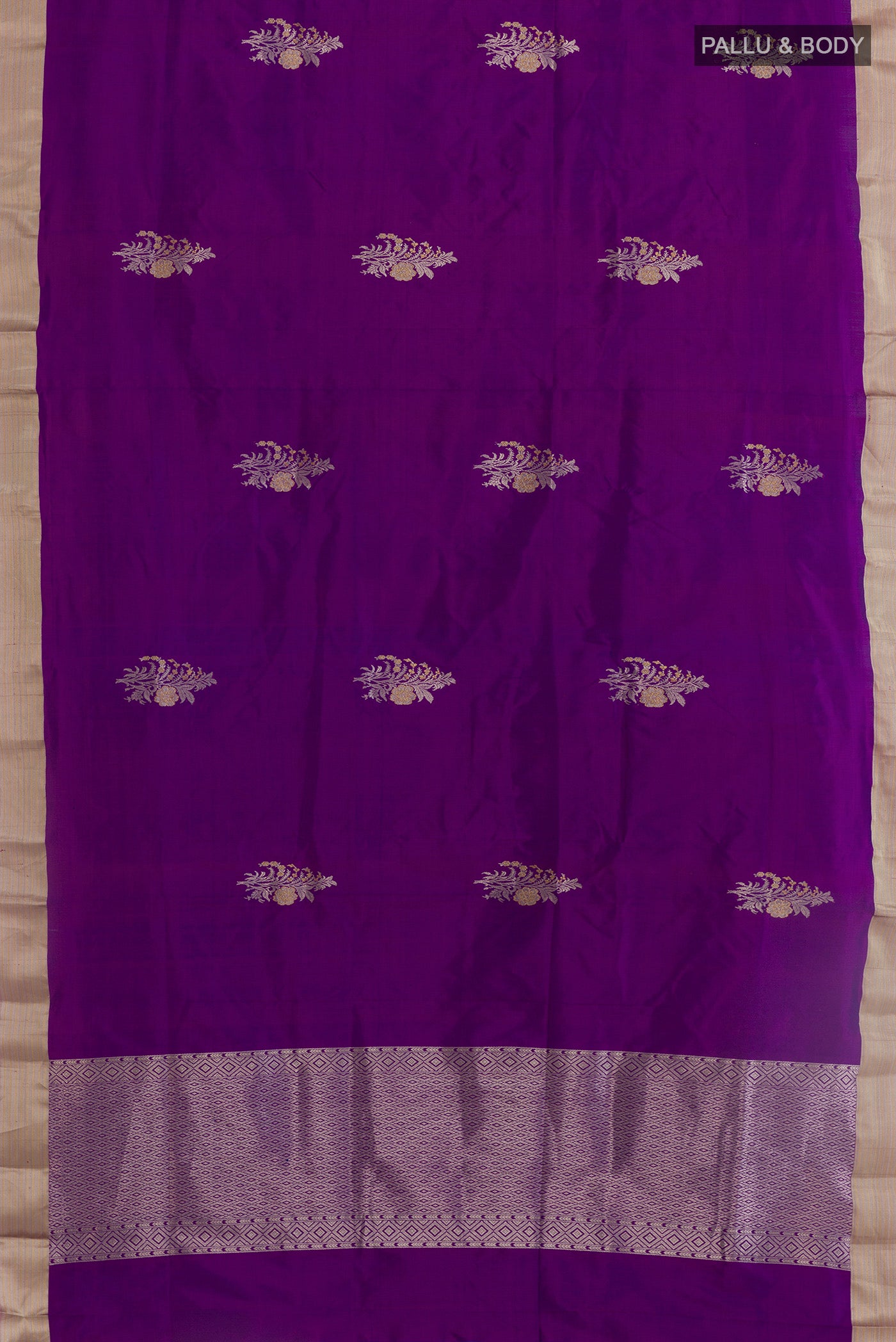 Flat view of Purple Banarasi Katan Silk Saree with Zari Butta on the body and Zari Border. 